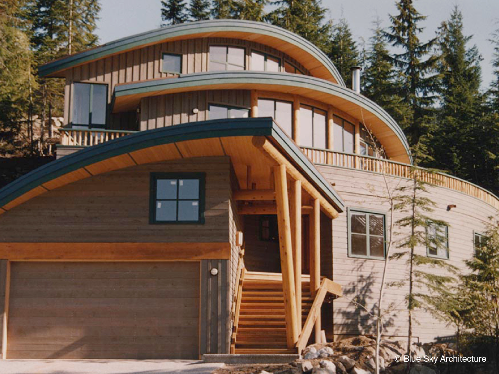 Residence with Radial Design and Natural Materials