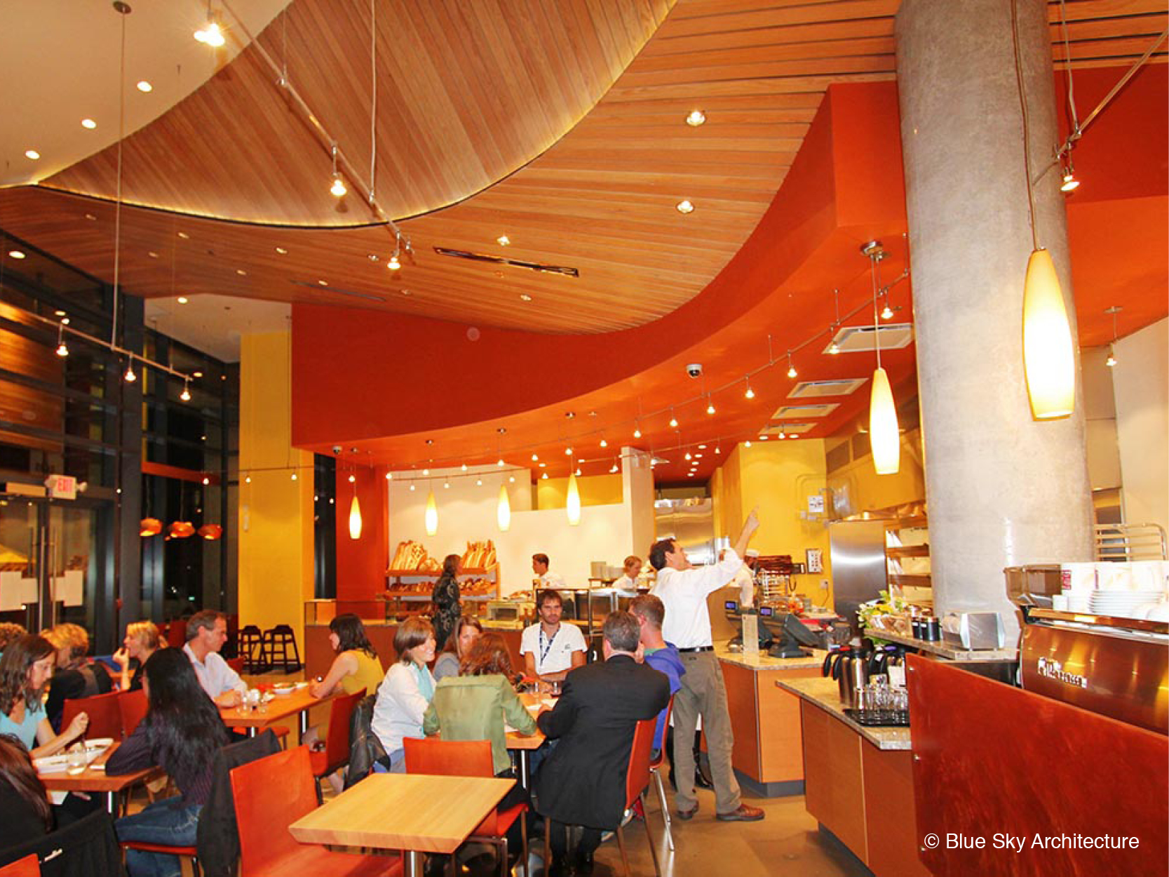 open dining plan with radial organic ceiling