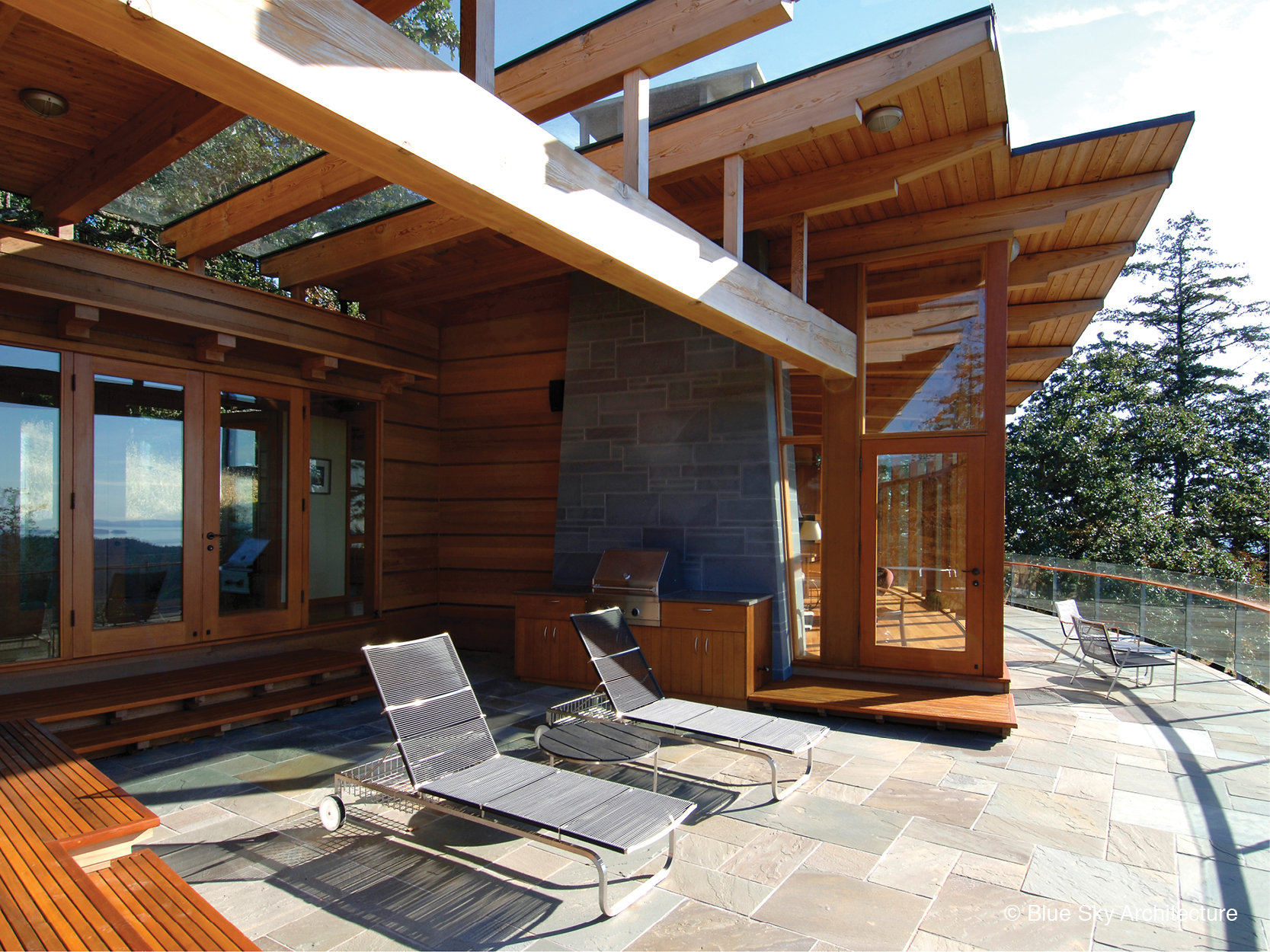 Oak Grove House outdoor living terrace with bluestone tile and cedar walls