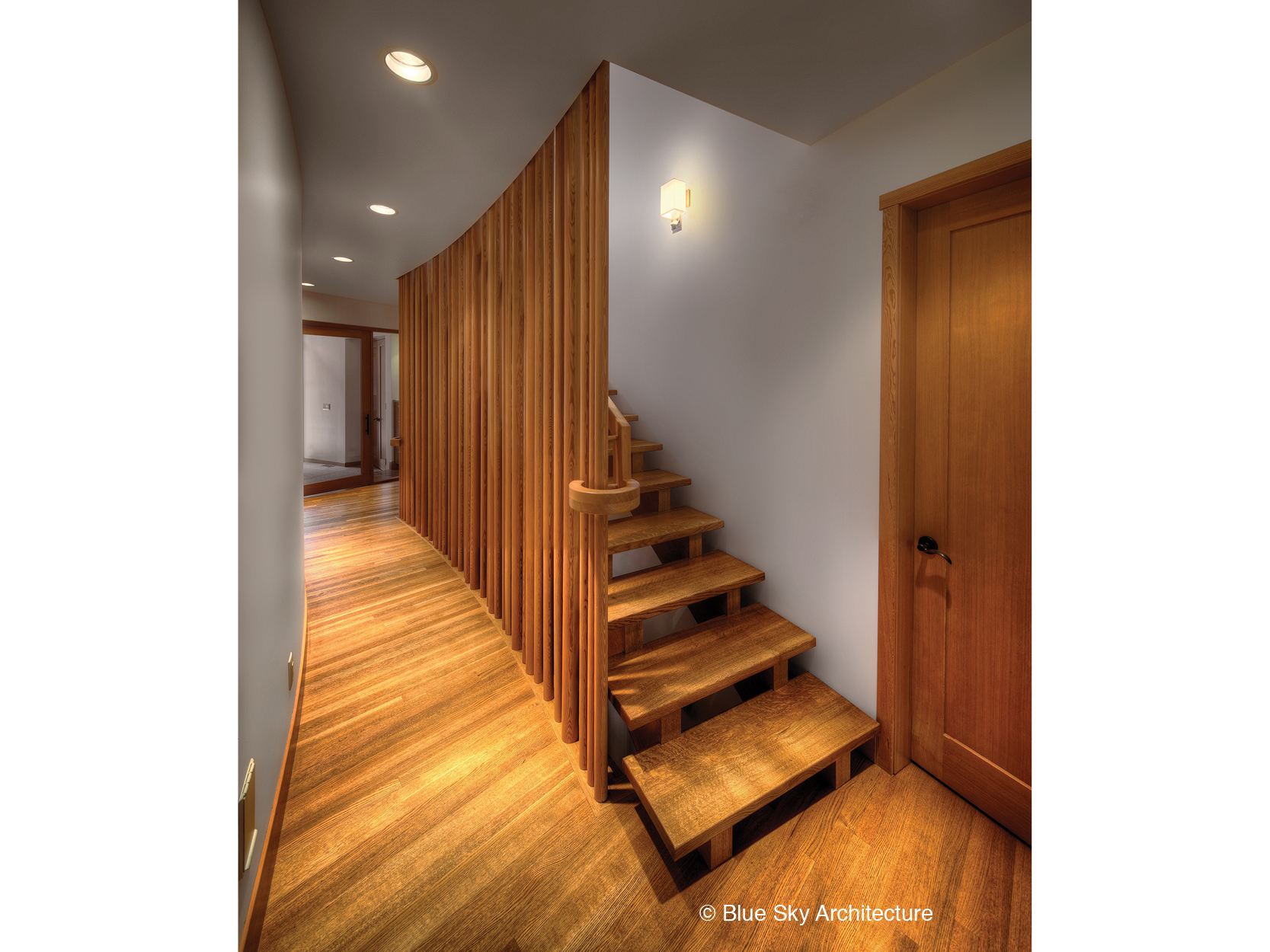 Wood screen hallway and stairs in the Assiniboine River House