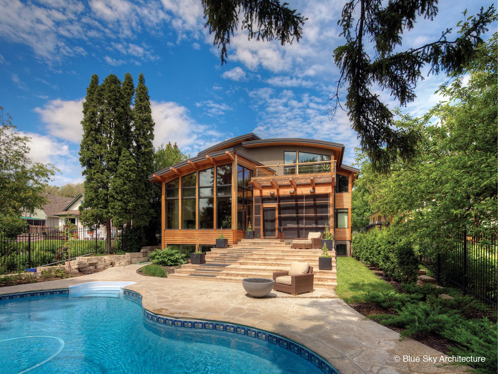 Assiniboine River house's organic architecture exterior, with terrace and pool