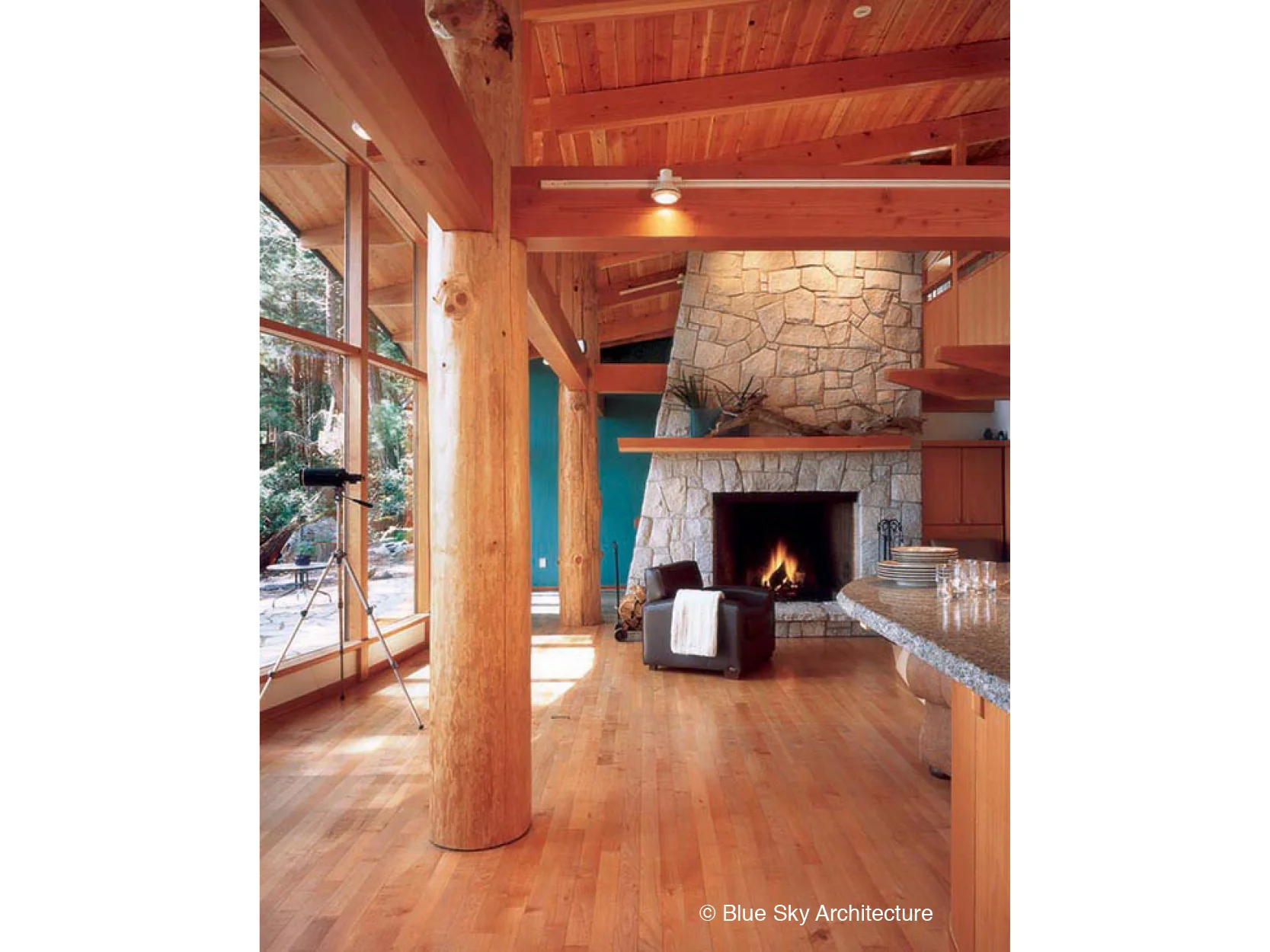 Heavy timber living room with stone fireplace