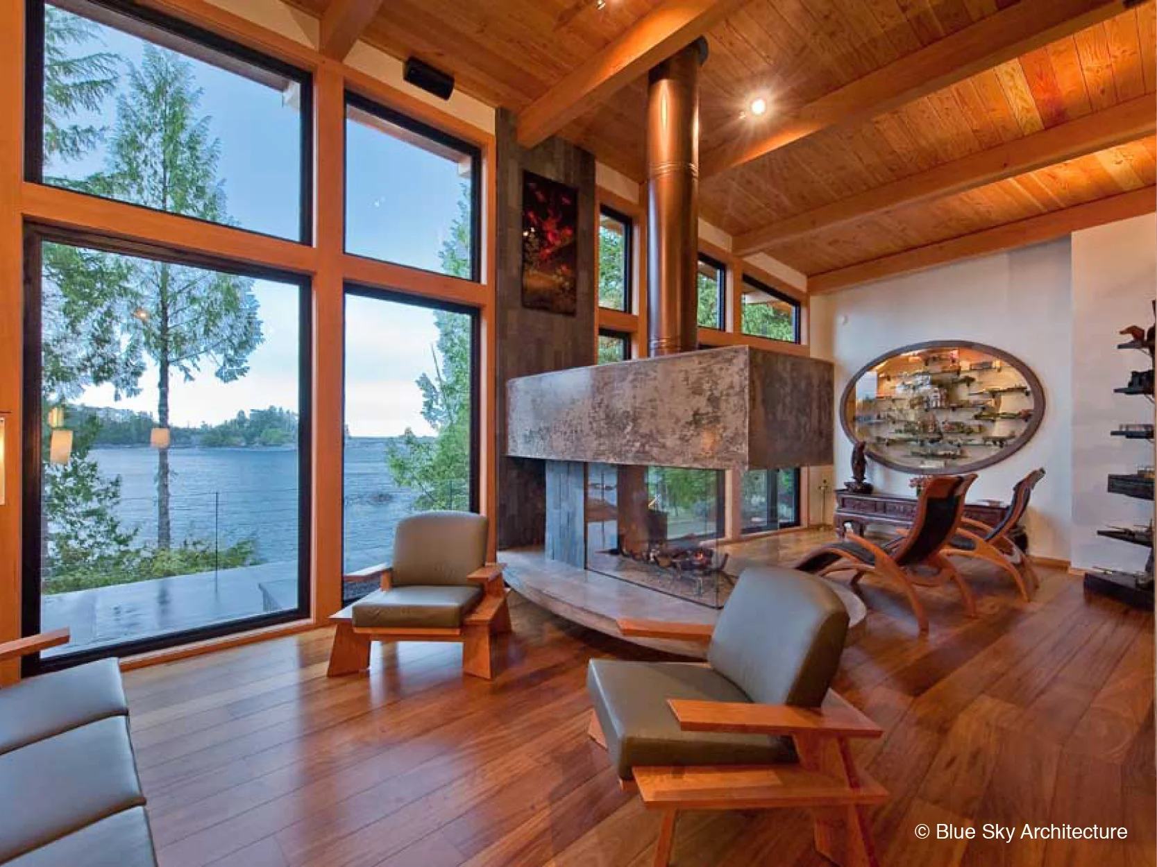 Concrete fireplace room divider in Ucluelet House living room