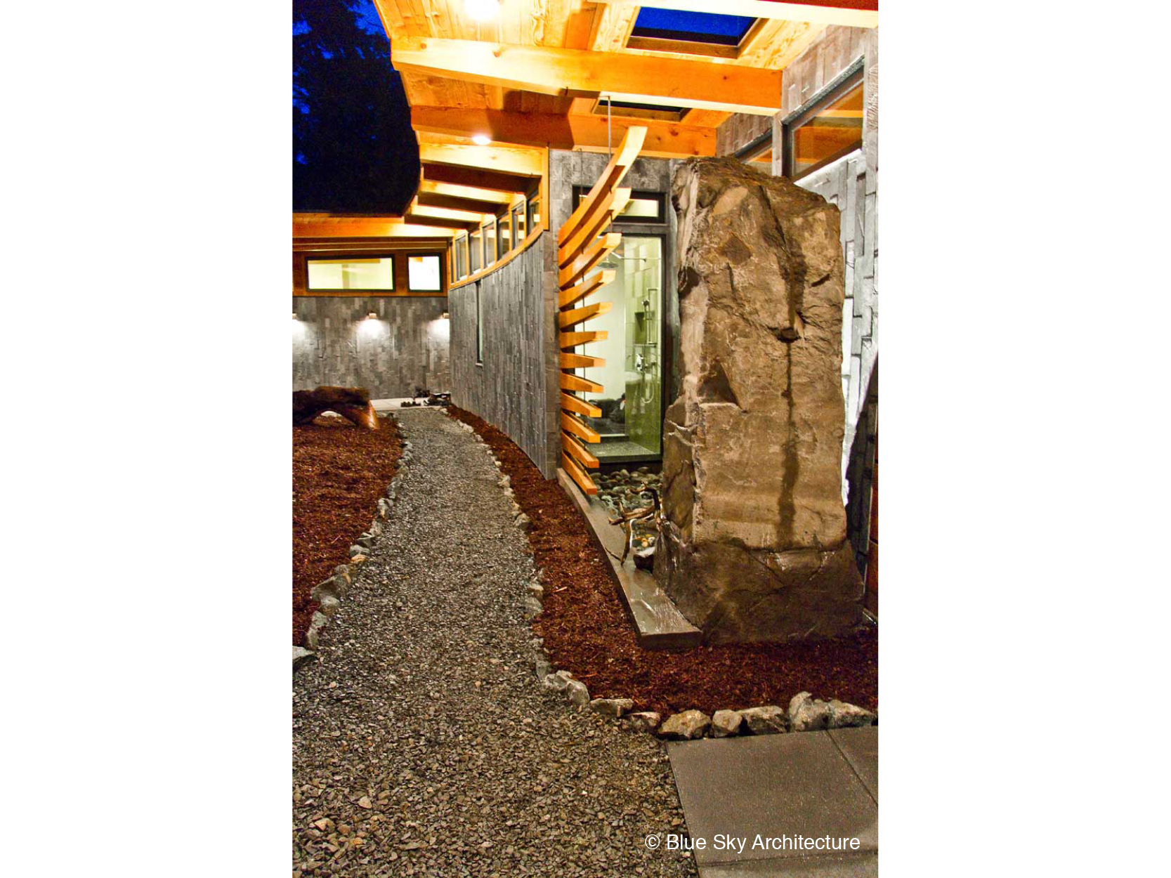 Stone detailing with a water feature on the entranceway to Ucluelet House