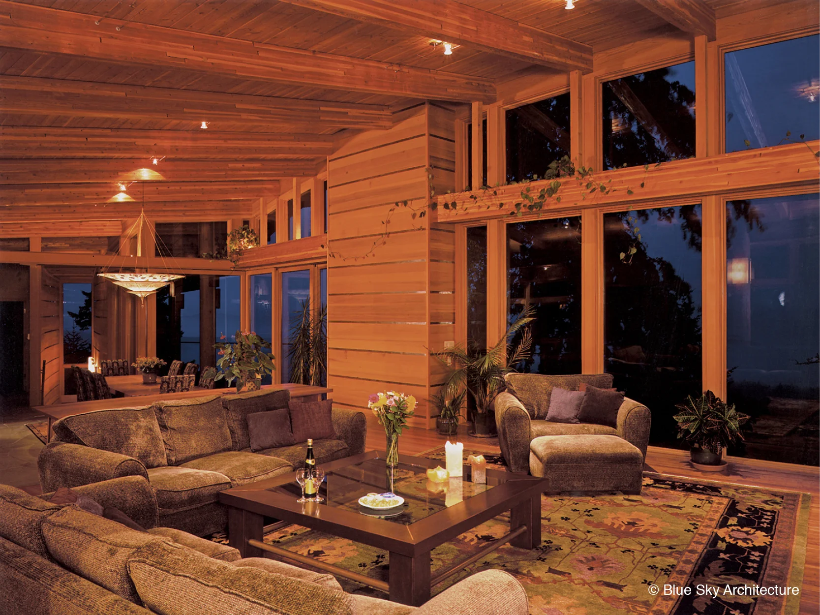 Heavy timber-framed windows in the living room of Hill House