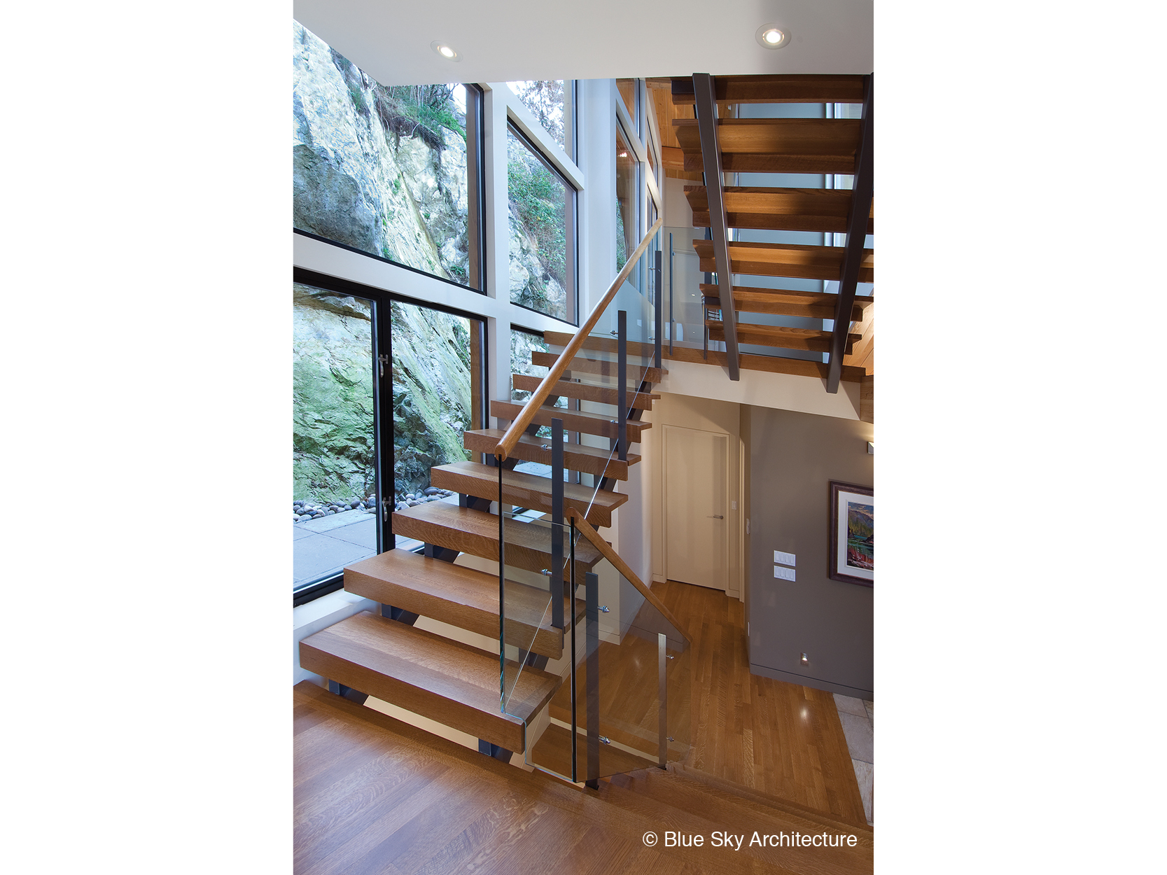 Natural lighting over the wood staircase of Harbour House