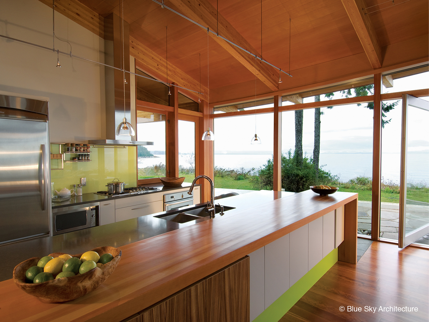 Natural lighting over the wood kitchen of Miracle Beach House