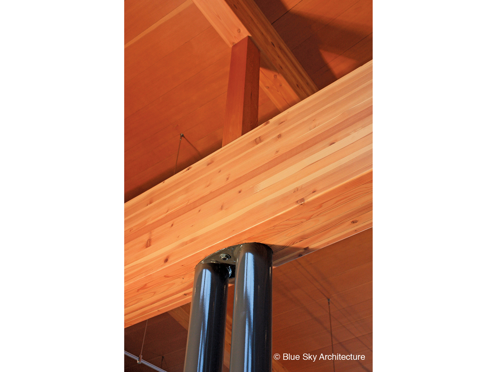 Steel column support of wood rafter in Miracle Beach House