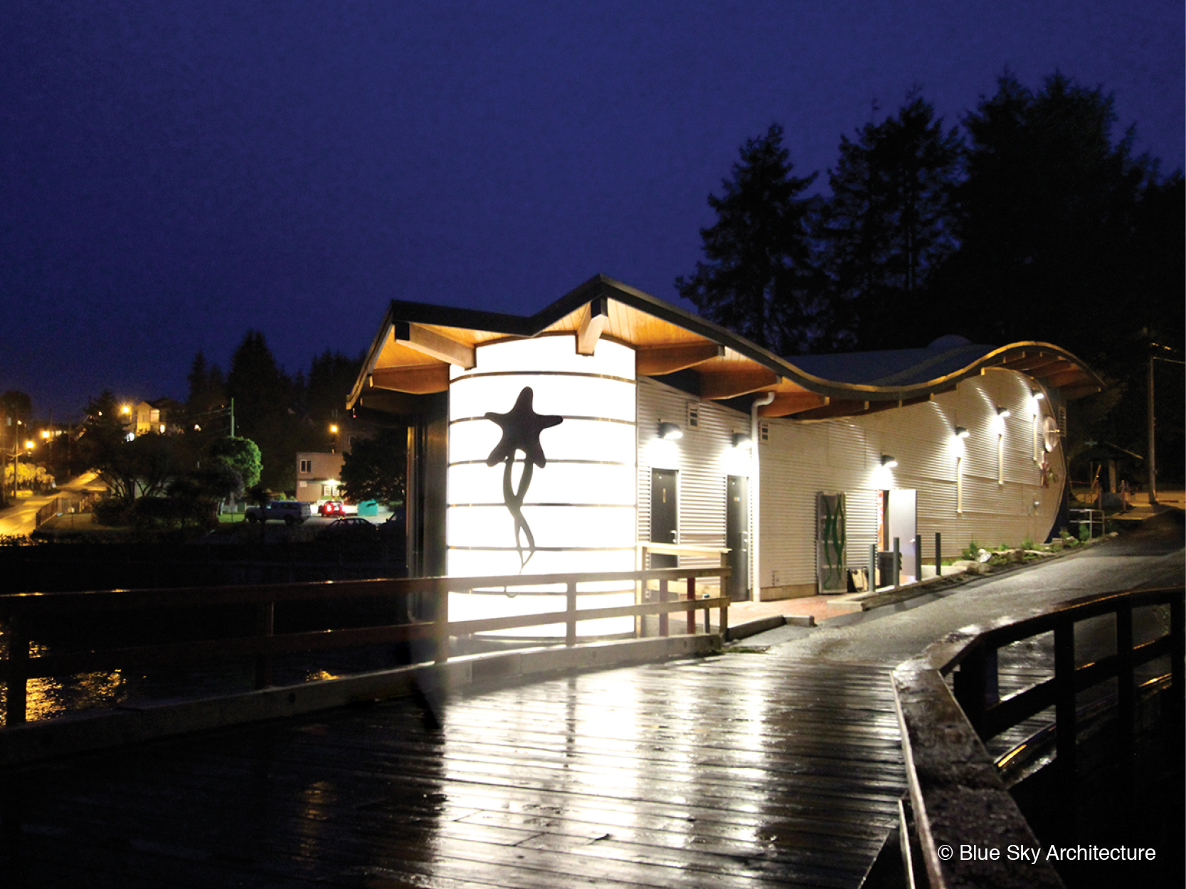 Exterior lights under the curved roof of the Ucluelet Aquarium