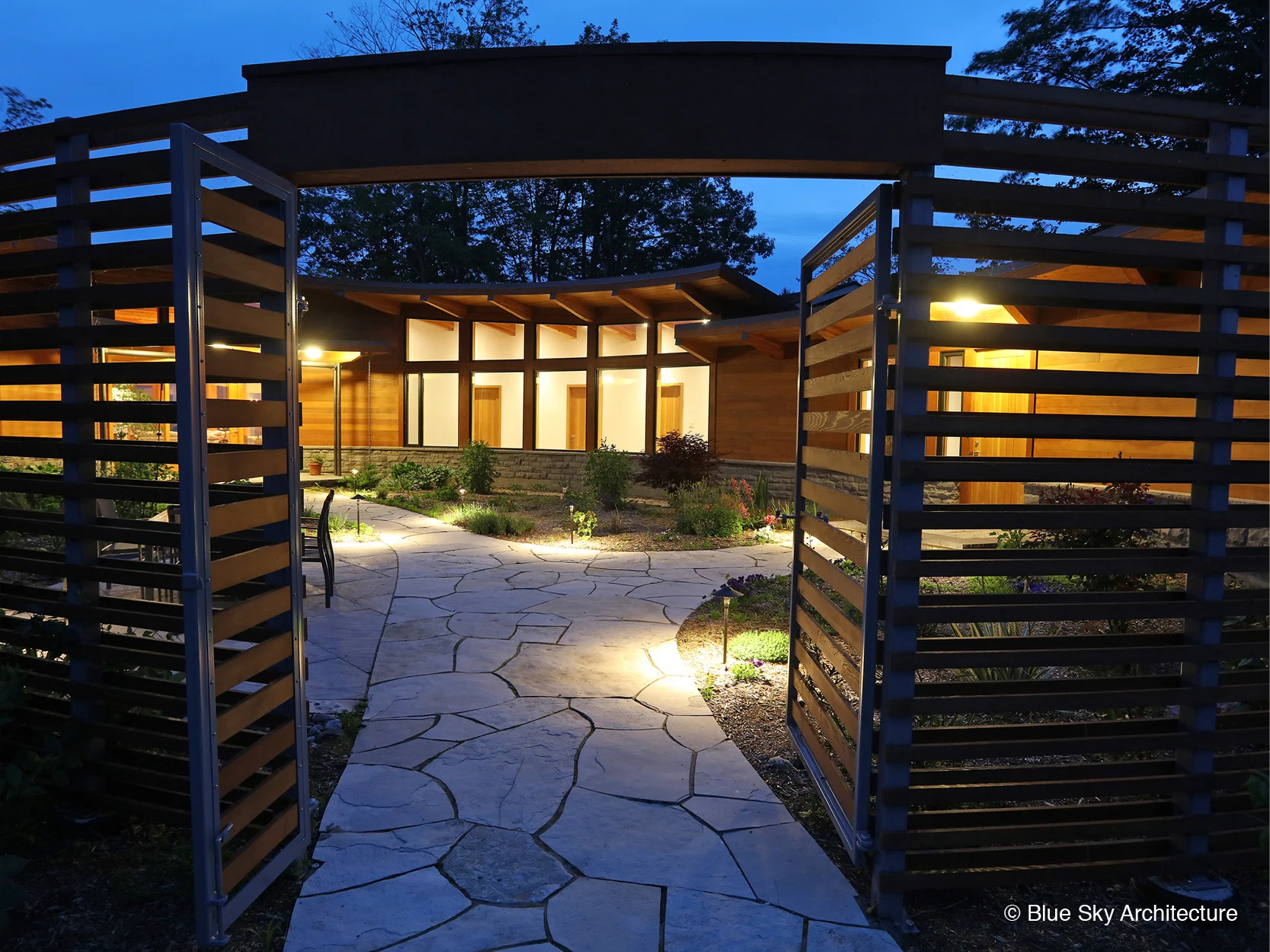 entrance canopy through landscaped courtyard