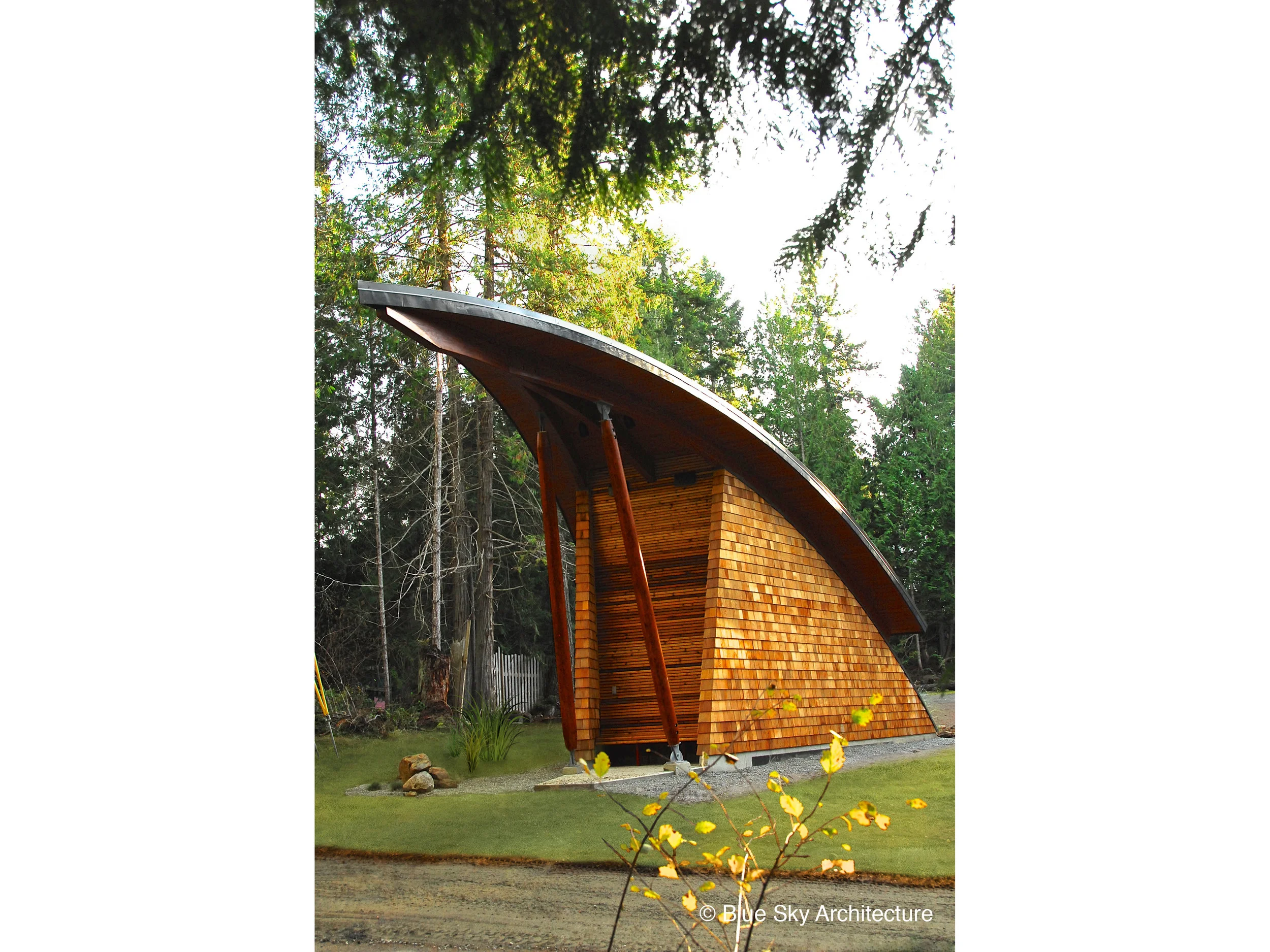 Exterior View with Shingle Siding and Sloped Posts