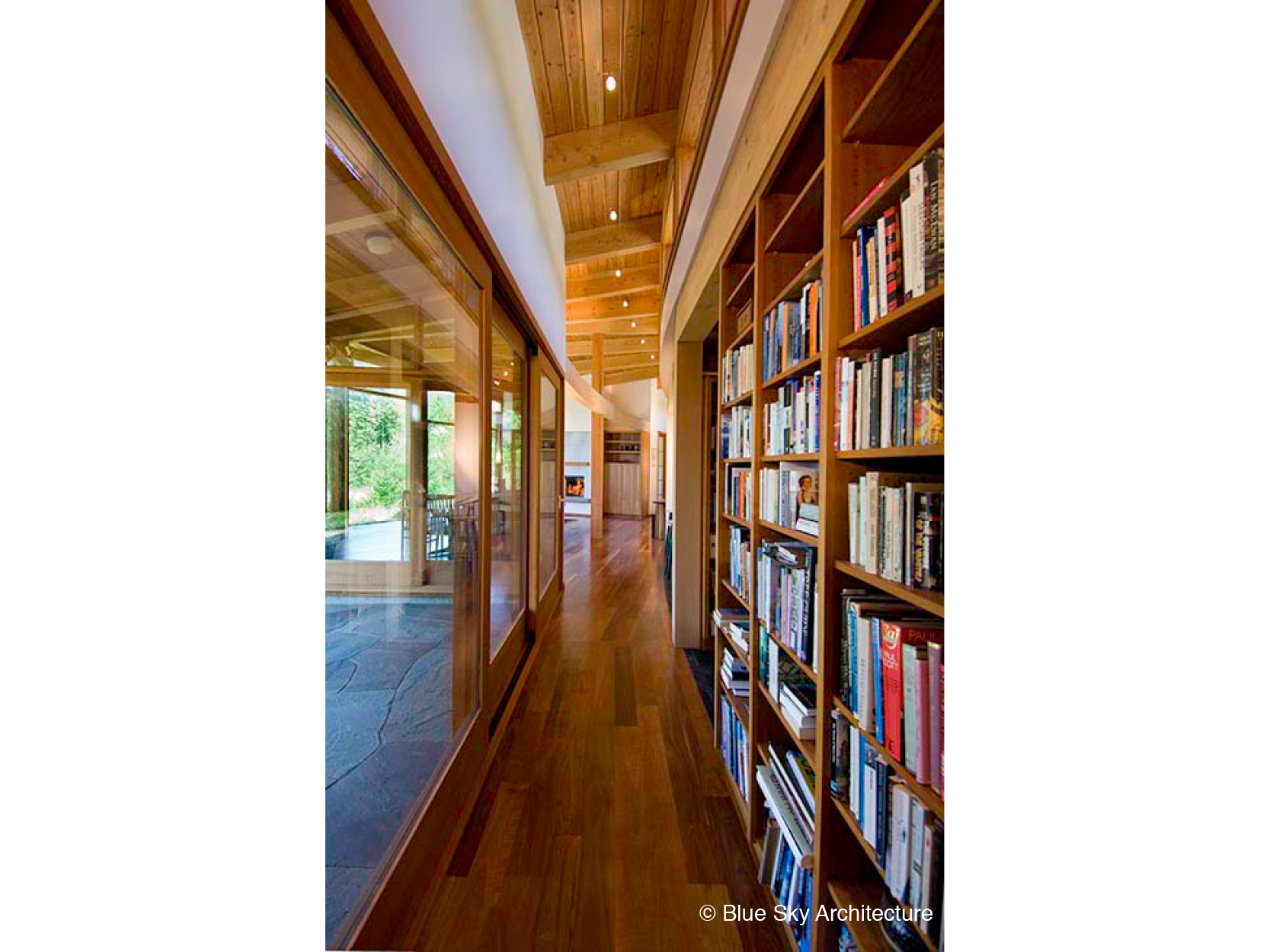 HollyFarm-house-hallway-bookshelves-wood-window.jpg