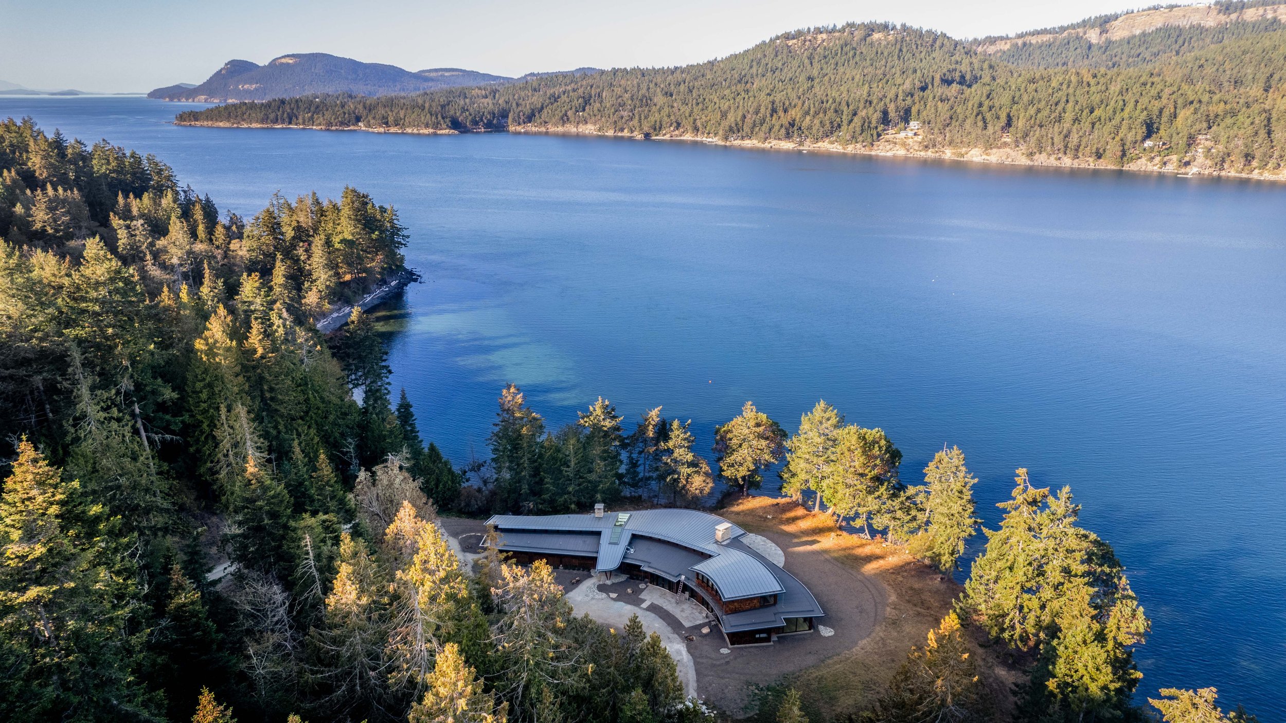 1. Aerial view of point house with Gulf Islands.jpg