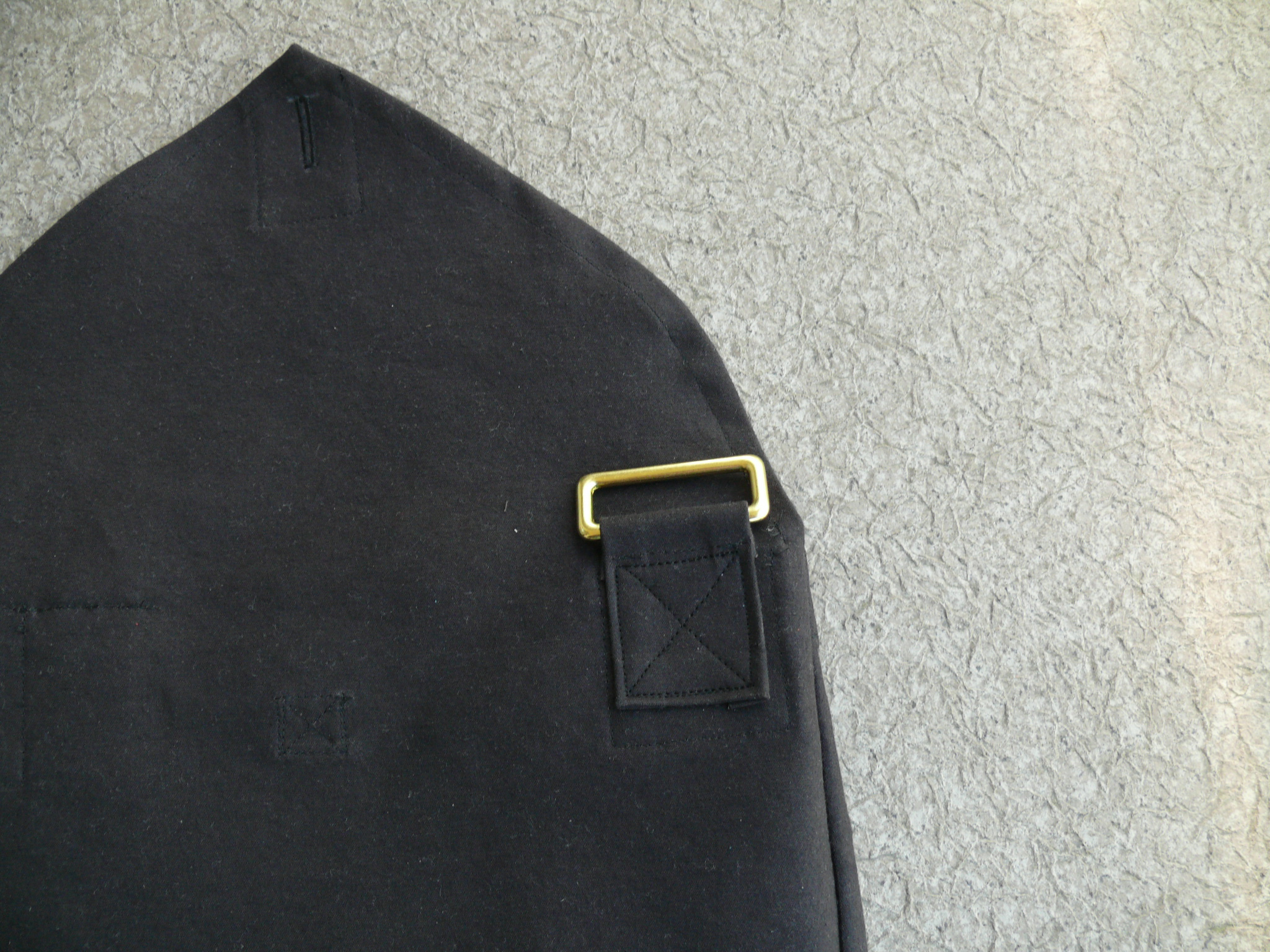 ...Sew onto the outside (right side) of the back piece to match up with the reinforcement piece on the inside (wrong side).