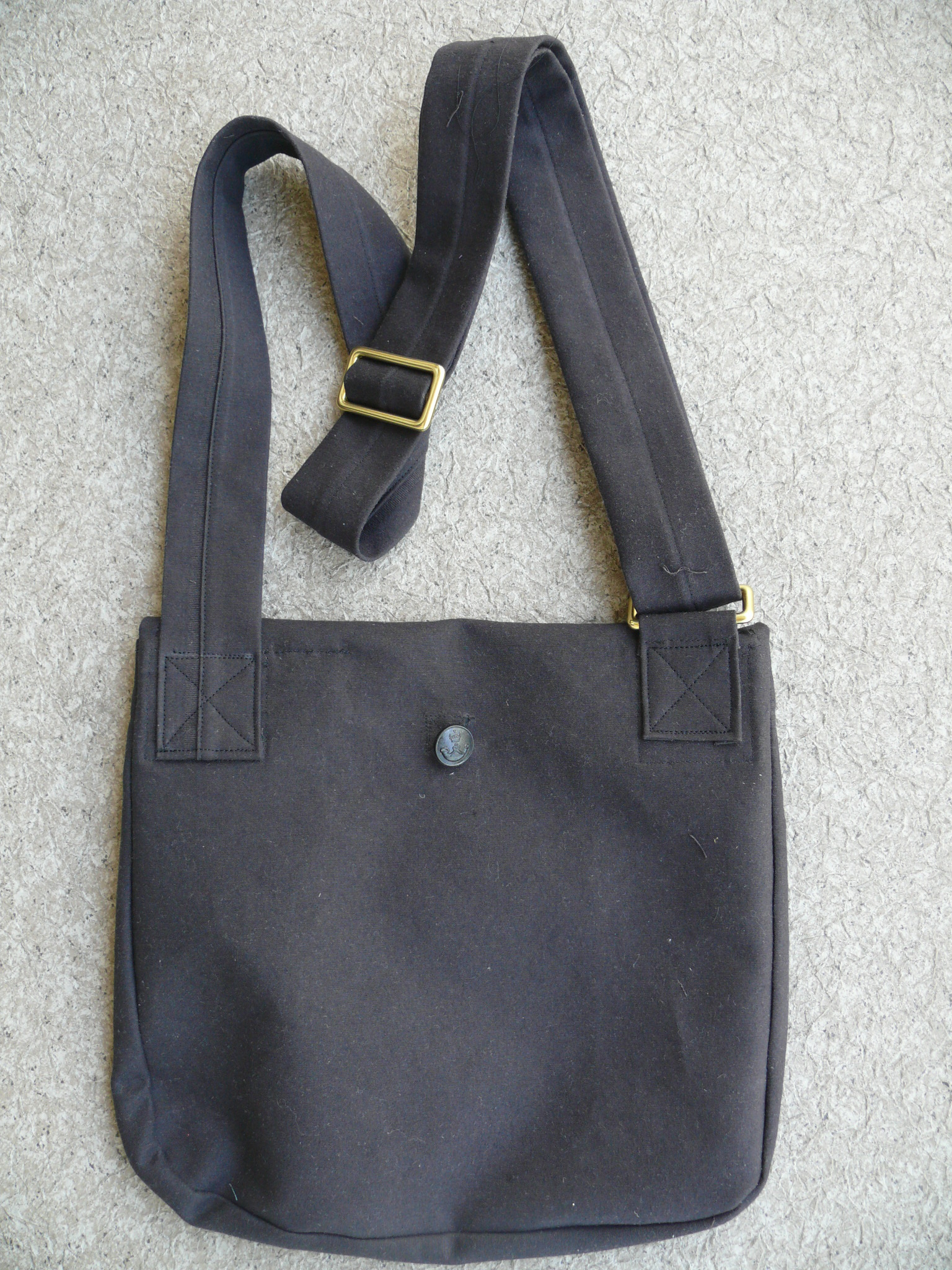 Back view.......The button on this side is used when the bag is empty and rolled up to conserve space.