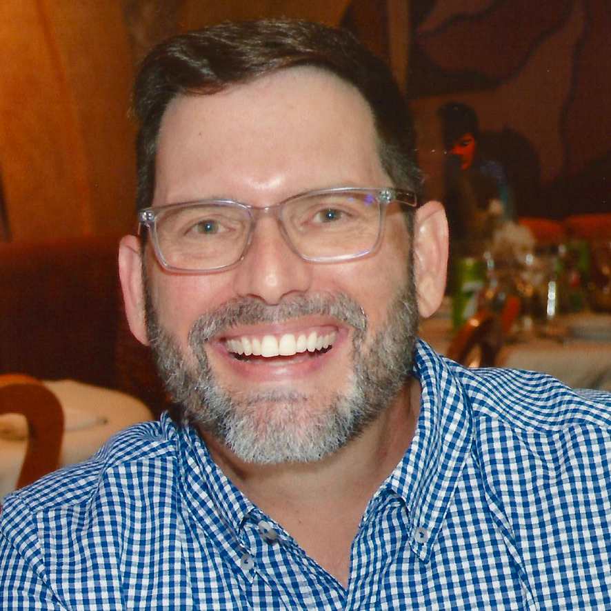 Dr. Greg Koch smiles warmly