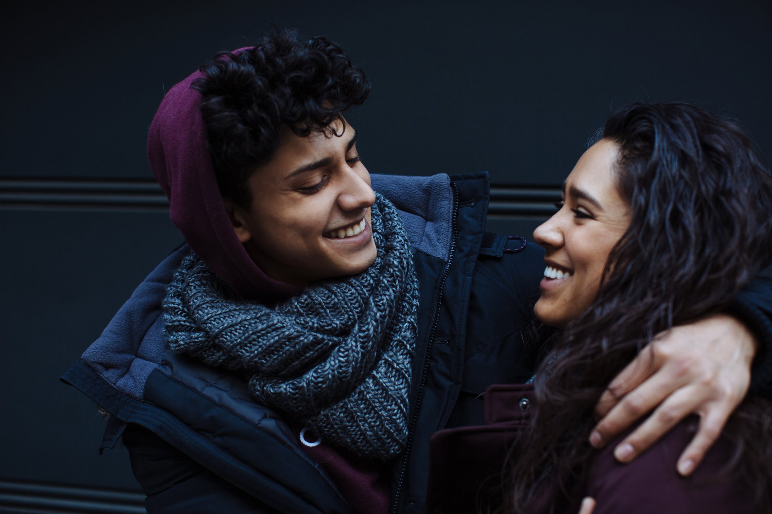 A couple smile at each other