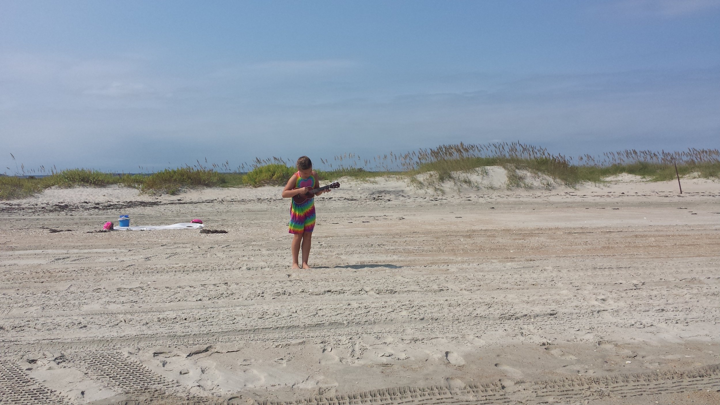 Bethany performing to an imaginary audience at the beach. She was jumping, bowing, and making up her own songs when she thought we weren't looking.