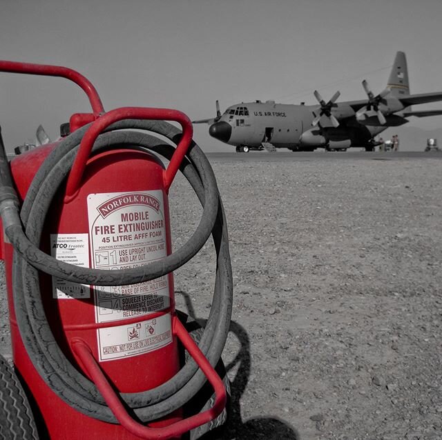 Forward deployed C-130 sits behind a fire extinguisher. #c130 #c130hercules  #forwarddeployed #airlift #fireextinguisher #kristofferglennimagery #kristofferpfalmer #pfalmer