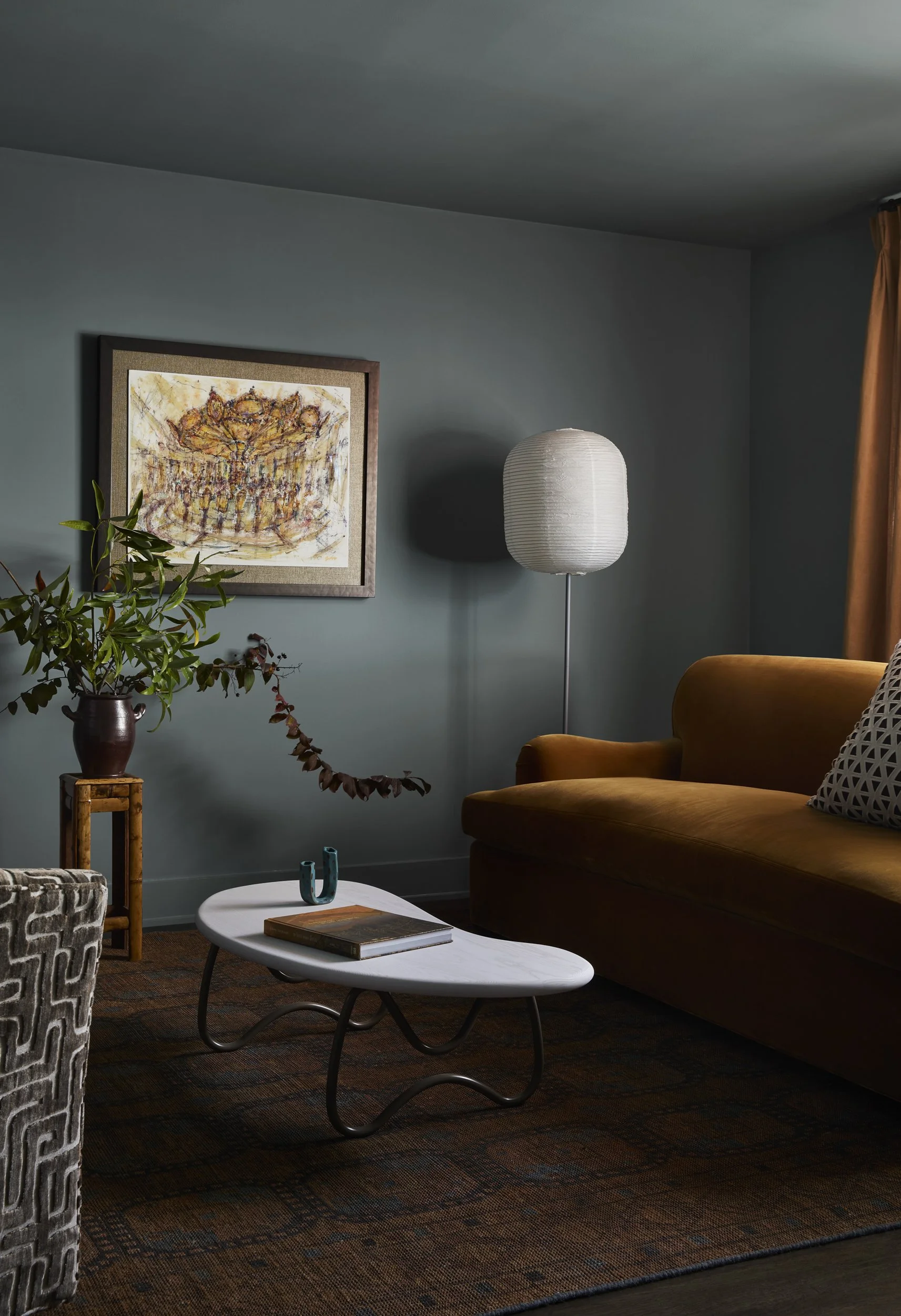 Uptown New Orleans living room painted in a saturated blue-gray hue. 