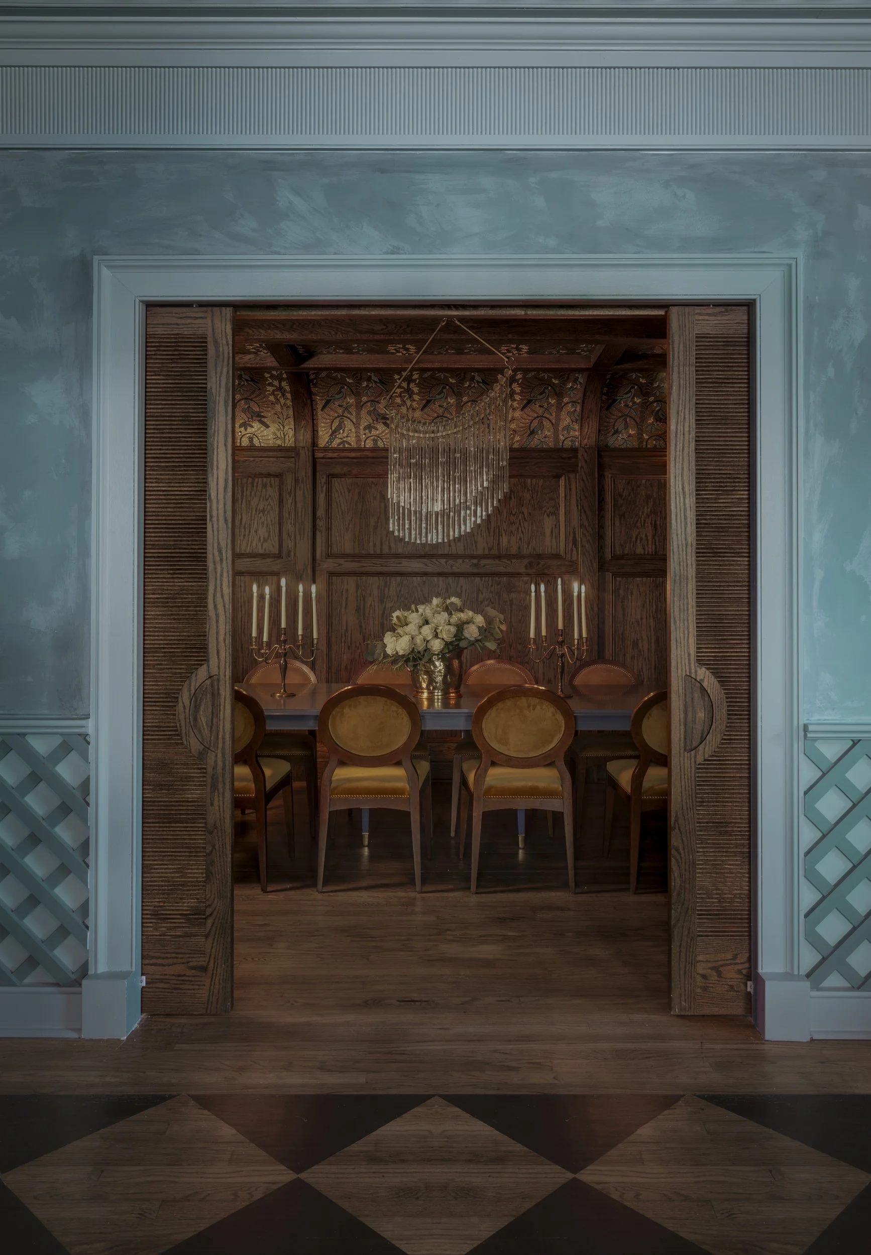 Pale blue plaster room opening onto an oak-paneled private dining room at The Colonel’s
Club, Baton Rouge
