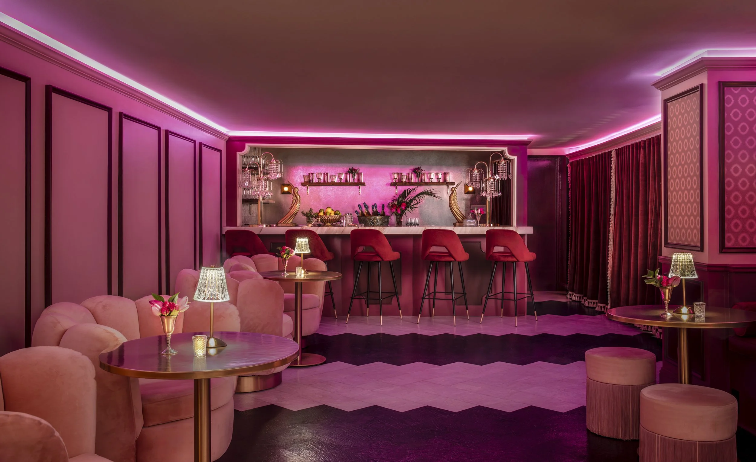 Pink velvet seating and chevron floor in the champagne bar at Mother’s, Baton Rouge