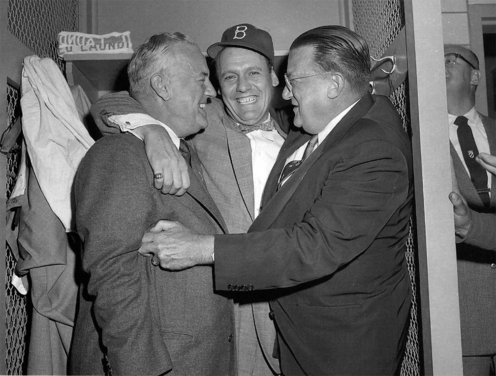  Bavasi (center) celebrating after Game 7 of the World Series with VP Fresco Thompson (L) and Owner Walter O’Malley. 