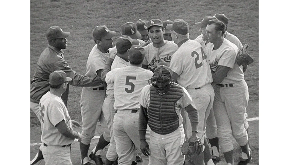   Dodgers win the World Series  Teammates surround Sandy Koufax after he hurled a 2-0 shutout over the Minnesota Twins to capture the 1965 World Series in the seventh game. 