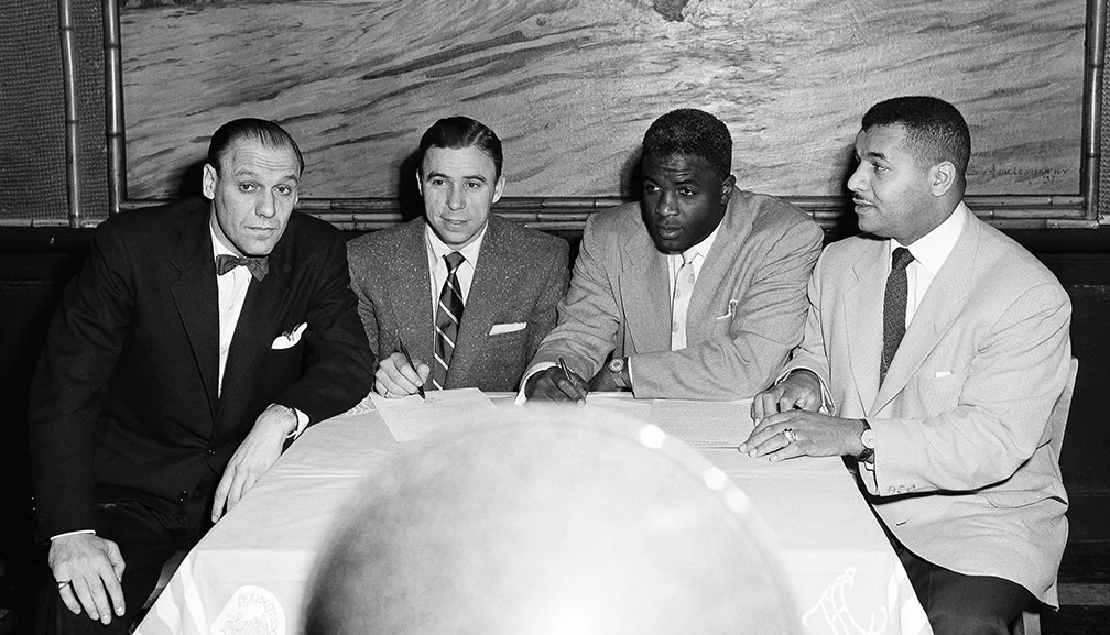 Bavasi with Dodgers stars Pee Wee Reese, Jackie Robinson, and Roy Campanella (L-R) after the signing of their contracts