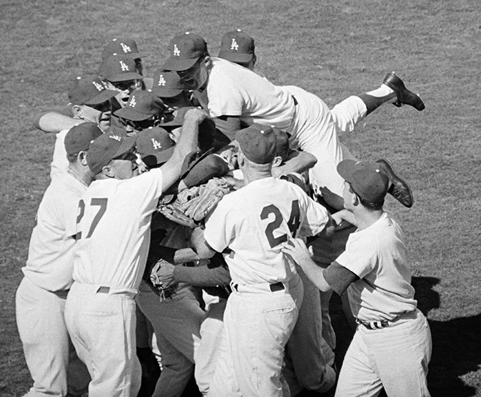 Los Angeles Dodgers win the World SeriesTeammates all but bury Sandy Koufax after he pitched them to a 2-1 victory, completing the Dodgers’ sweep of the Yankees for the World Series championship.