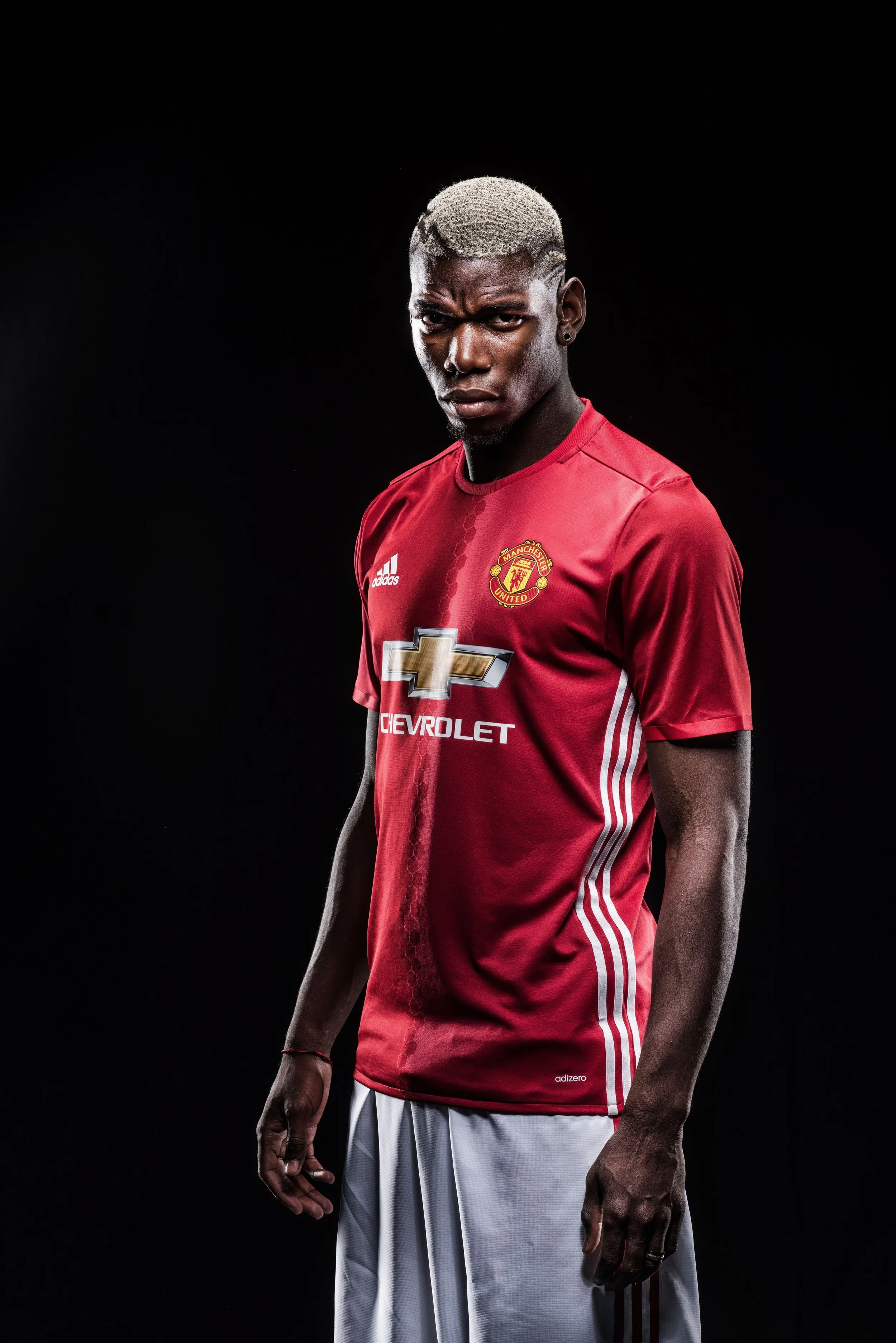 Billeder som disse fra Manchester Uniteds egne optagelser er en del af iscenesættelsen og ikoniseringen af Paul Pogba. Foto: Getty Images/Manchester United