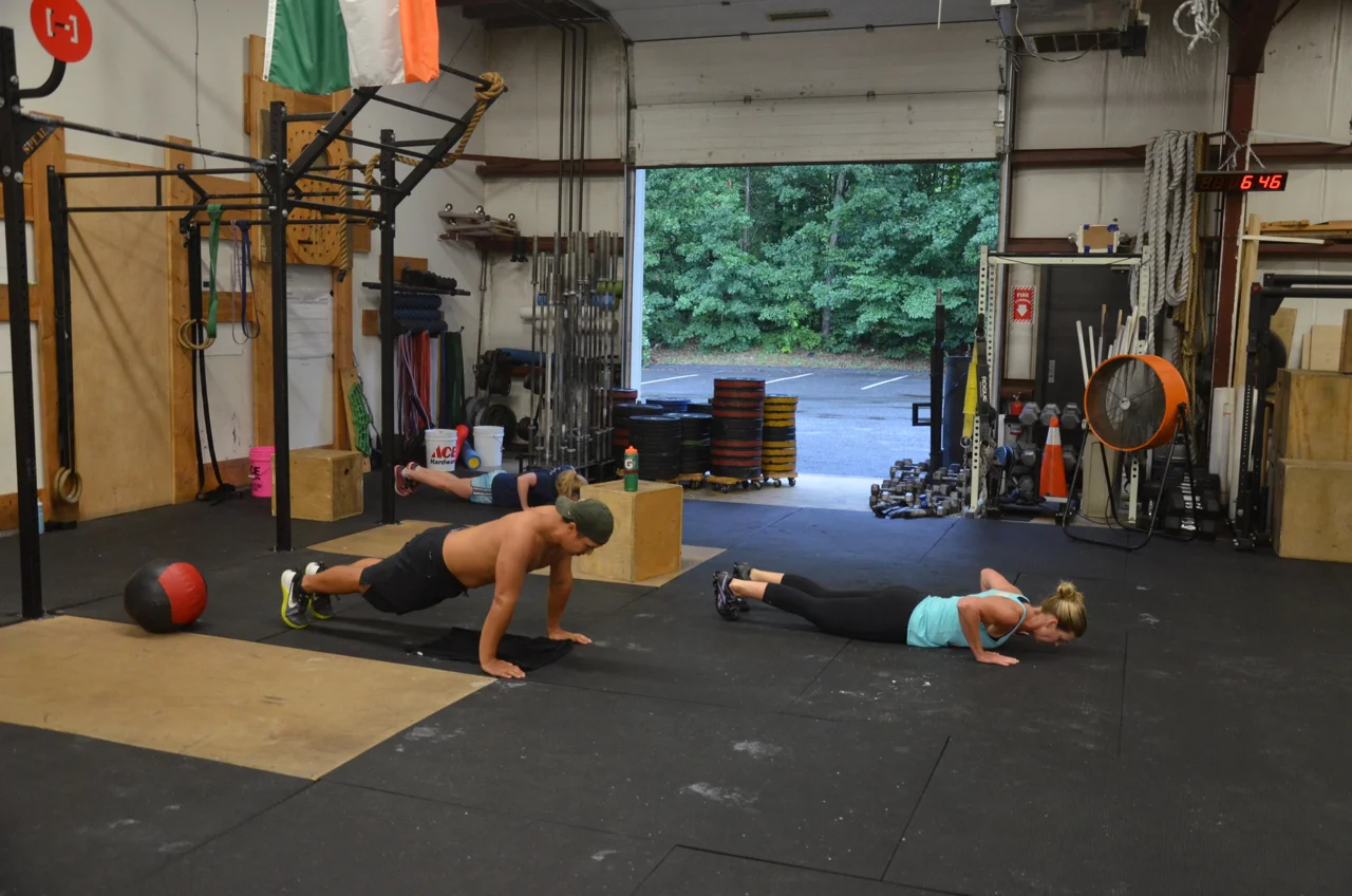 Toon, Rosemary, and Sydney working through their push-ups.
