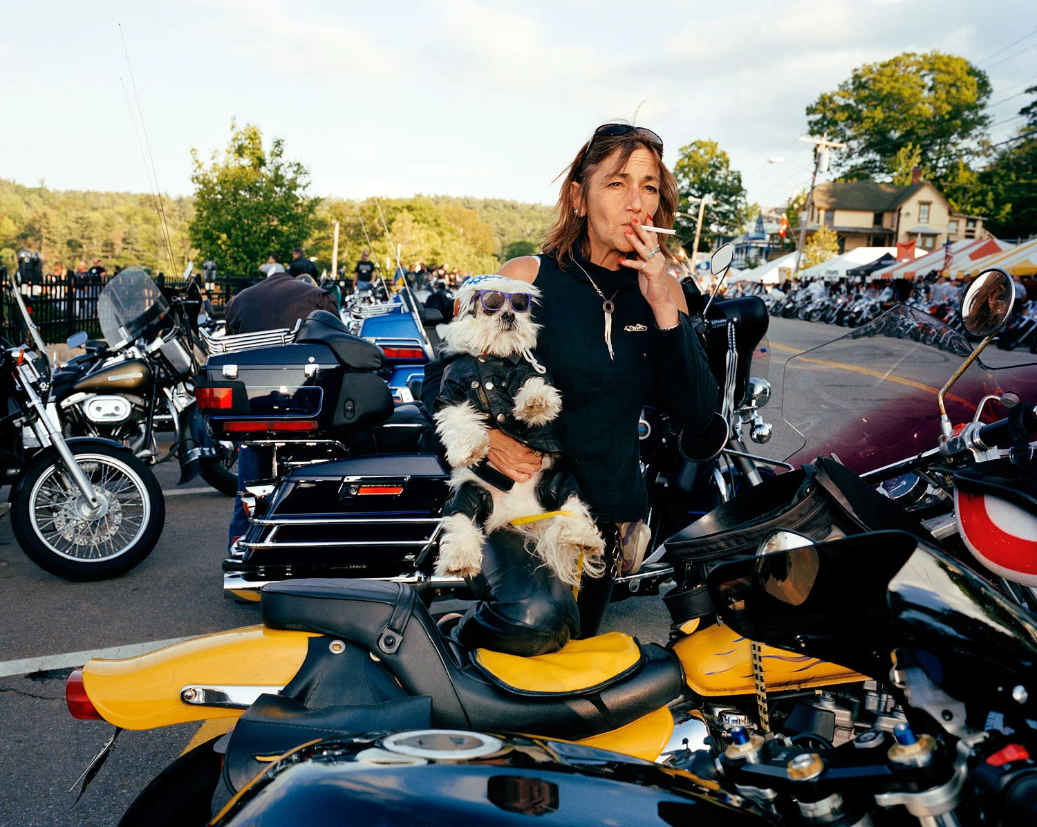 Woman and dog in leather, Motorcycle Week, Weirs Beach, NH, 2003