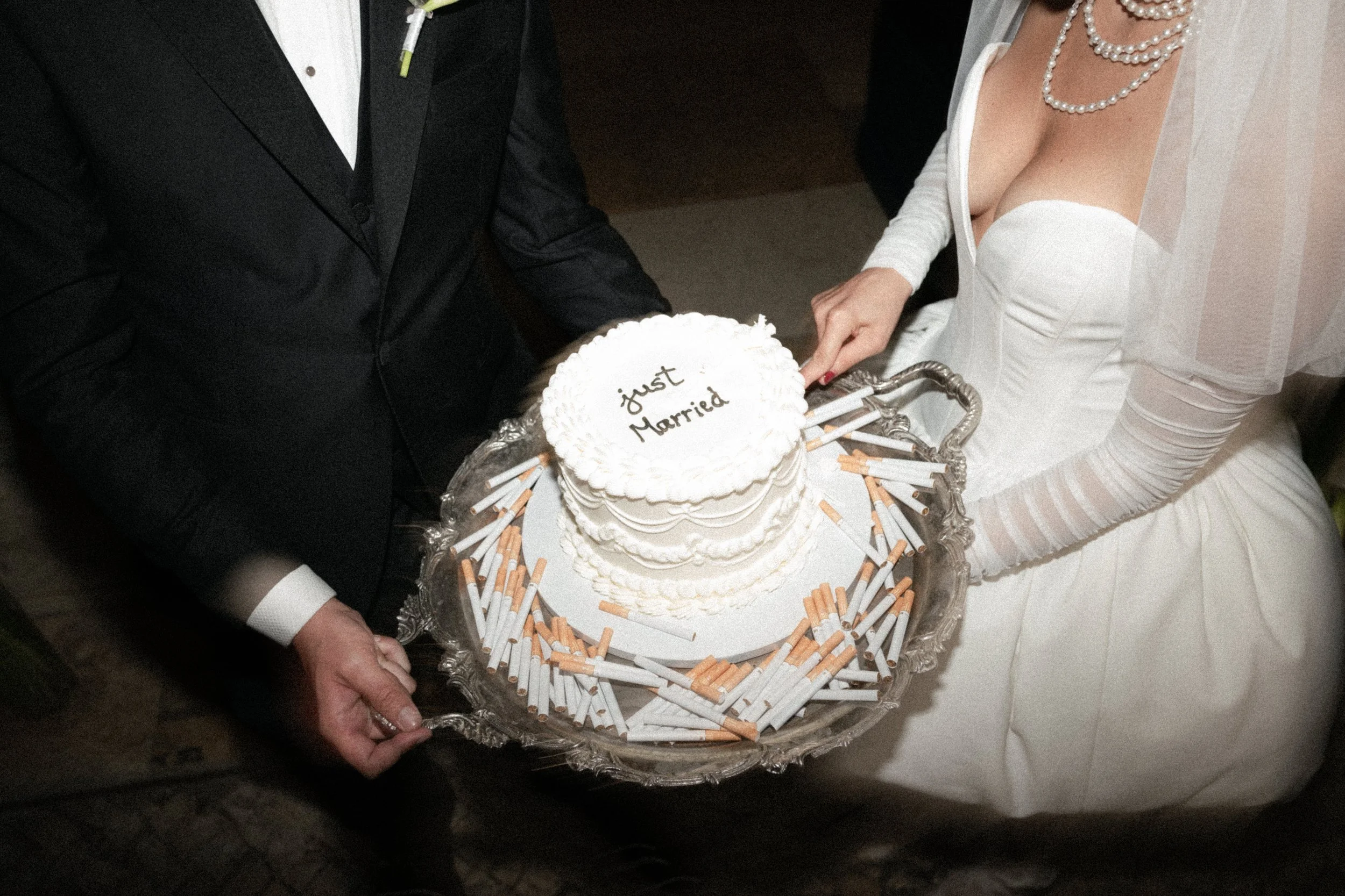 Just married cake with cigarettes on tray
