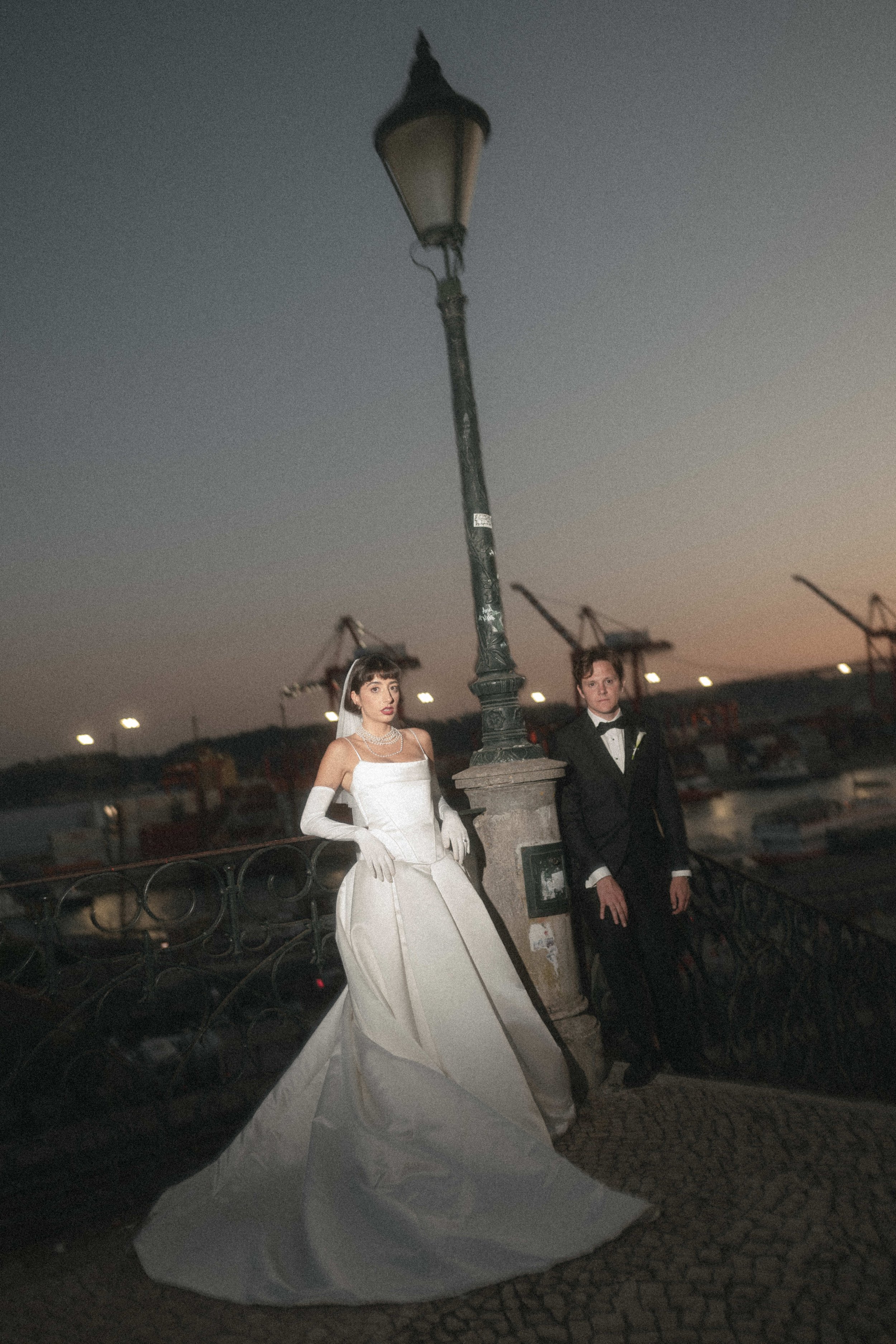 Real Bride Wears Pronovias Axelle Gown in Cinematic Wedding Photos by lamp post