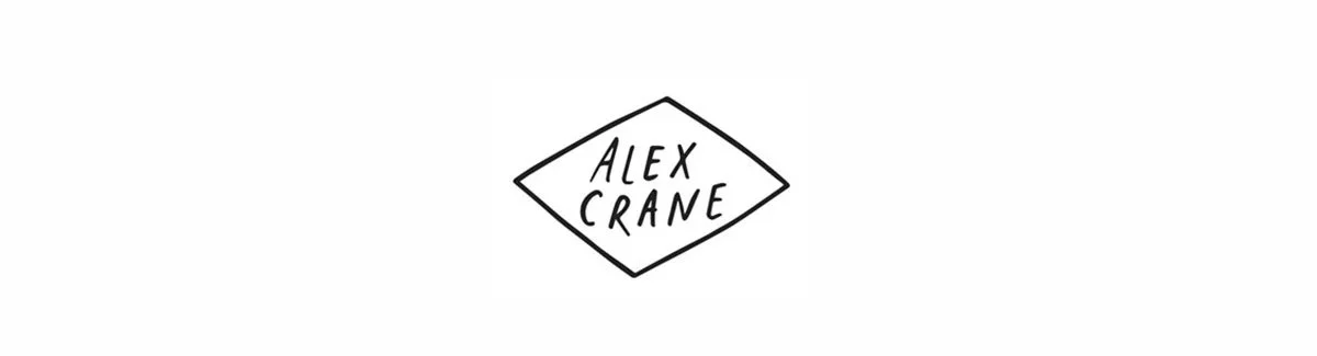 Black text on a white background reading 'Alex Crane' inside a diamond shape.