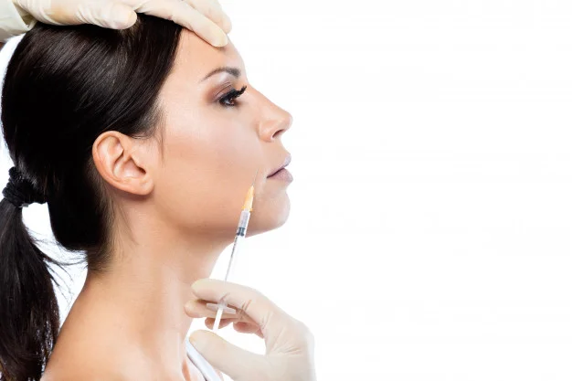 beautiful-young-woman-getting-botox-cosmetic-injection-in-her-face_1301-7525.jpg