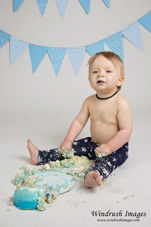 Baby-boy-finished-with-destroyed-cake-photographed-by-Calgary-cake-smash-photographer