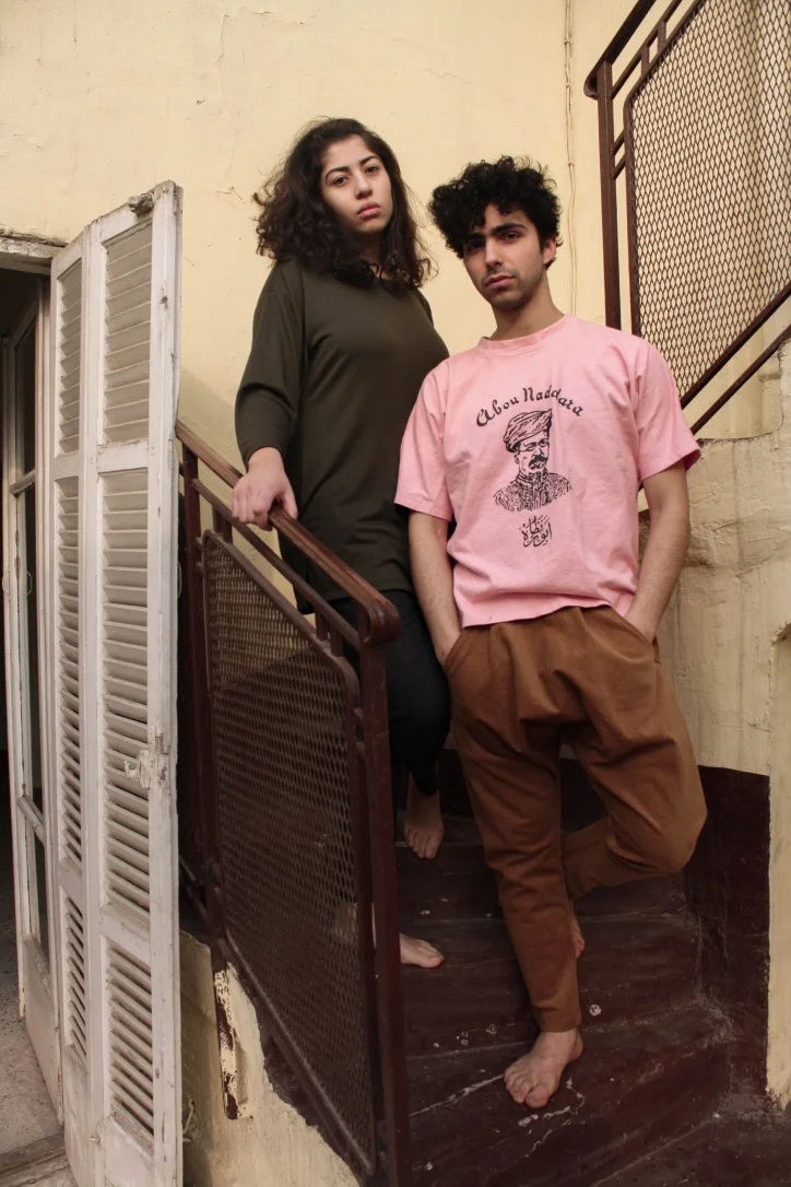 Cairo, Egypt. - The shirt features an illustration of 'Abou Naddara', which is an Egyptian revolutionary magazine that was distributed from the late 19th to the early 20th century. 'Abou Naddara' or 'Father of the Glasses', was the nickname of a man named Yaqub (James) Sanua who was an Italian jew who moved to Egypt and became a distinct Arab nationalist.