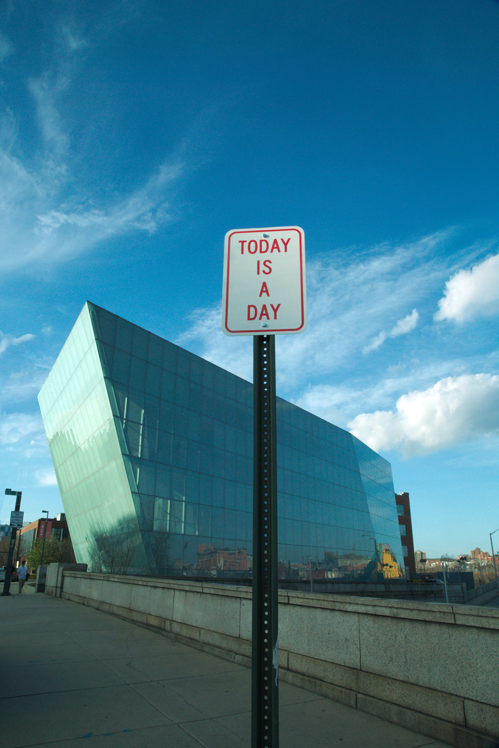  A series of altered street signs, speaking the same language as the paper towels, existed outside of the gallery. 