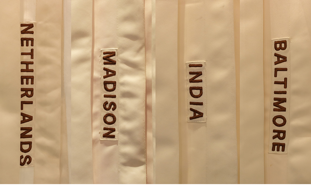  The labels signify the different experiences that communicate to the audience that there is variety and that they can make a choice. The pleats on the outer surface of the tent add a pleasant visual pattern. The hand-embroidered labels on the tents 