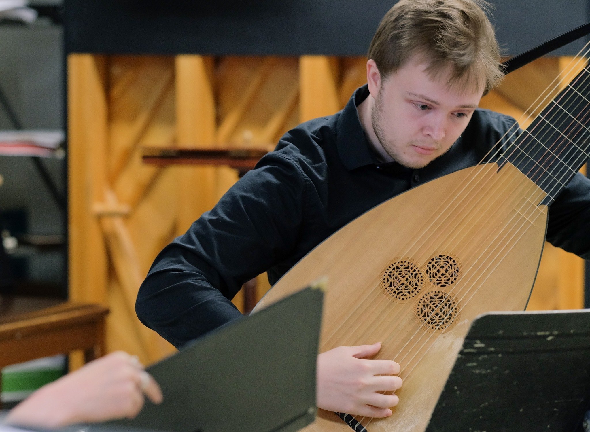  Rehearsing Baroque songs on theorbo at the Tafelmusik Baroque Summer Institute 