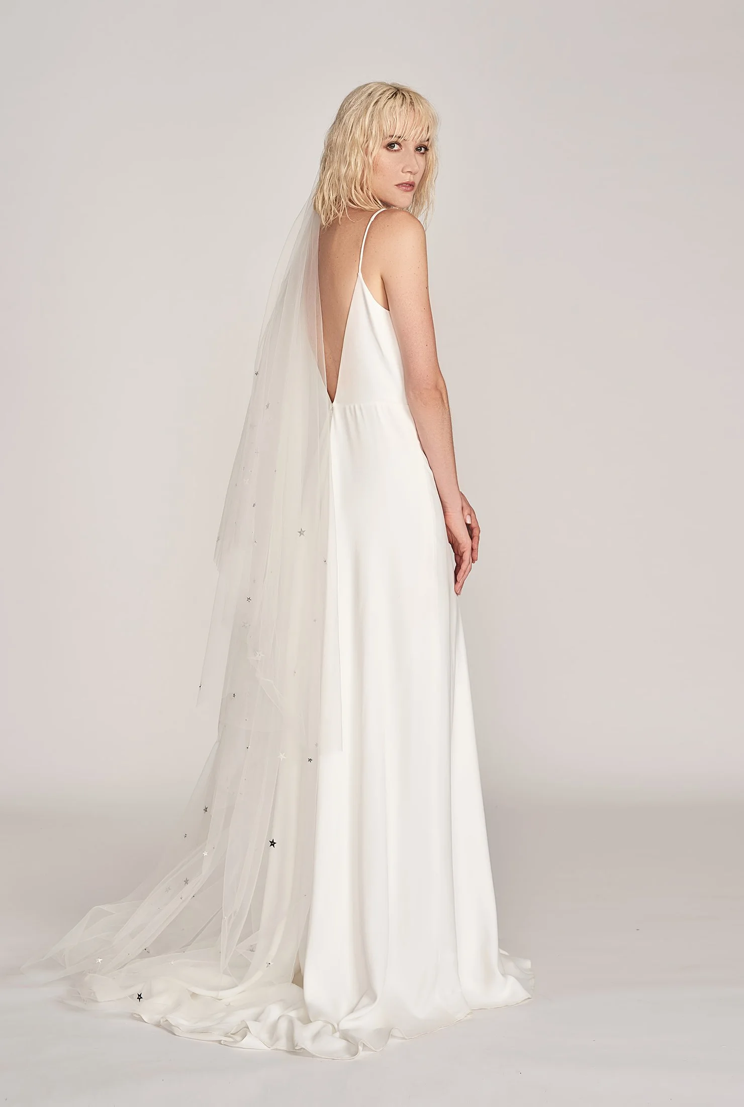 Charlie Brear Fernley Gown, $3250, Through The White Door, Dove Grey Bridal Star Drop Veil, $520, Hope X Page .