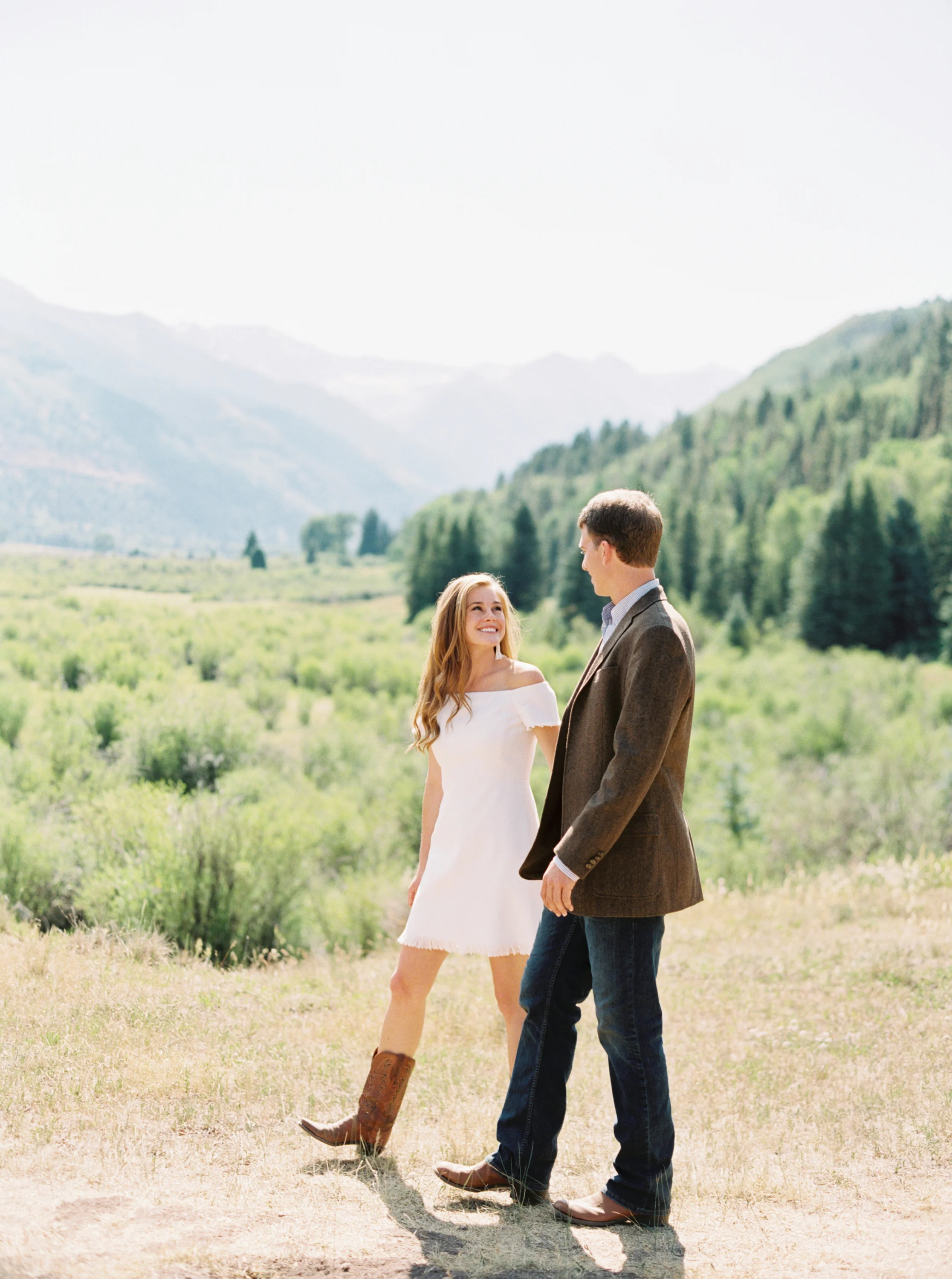 Bride and groom walk in Telluride valley by Top Colorado Wedding Photographer Hannah Mayson
