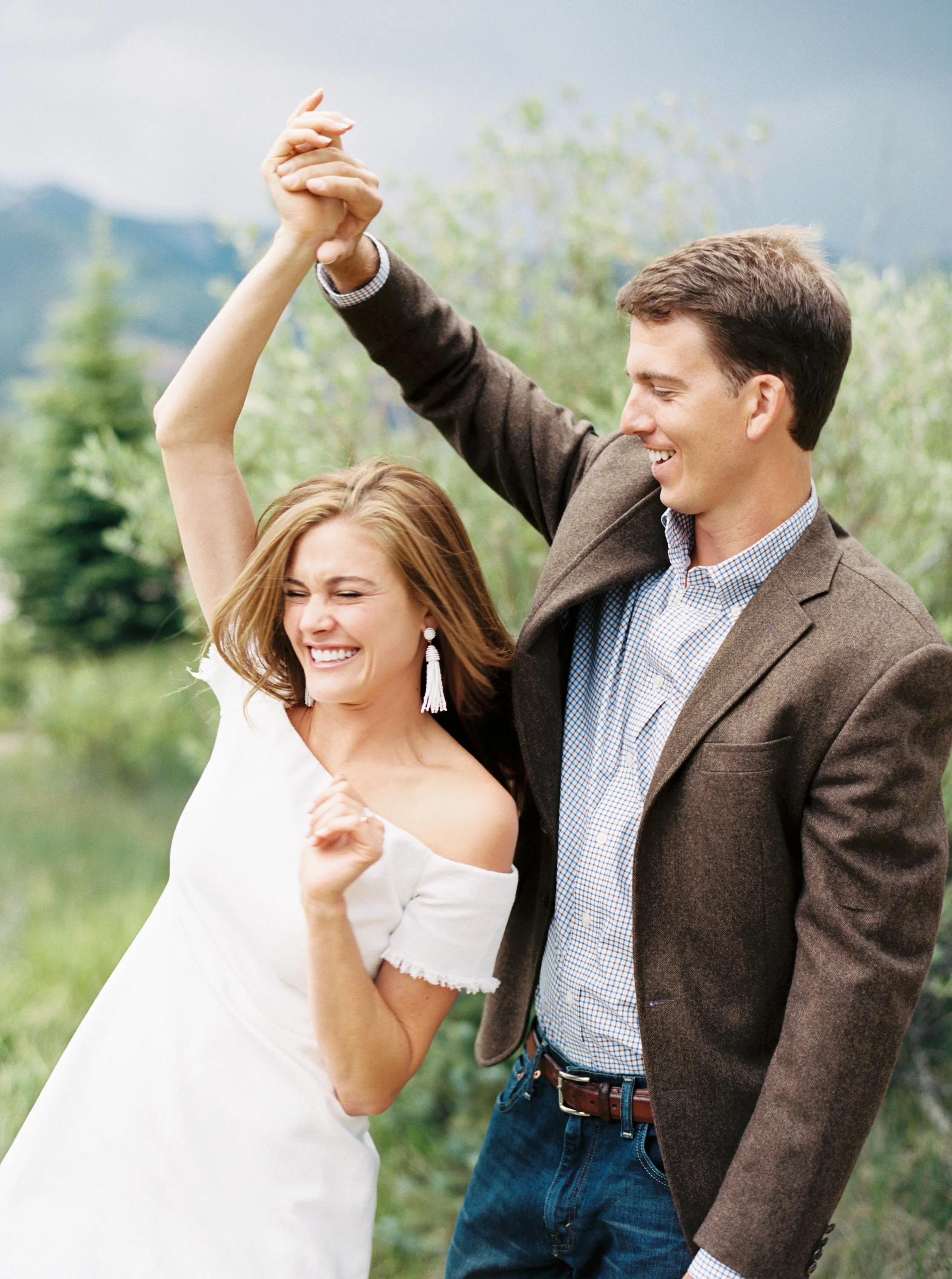 Groom twirls bride in Telluride Engagement Pictures by Top Colorado Photographer Hannah Mayson