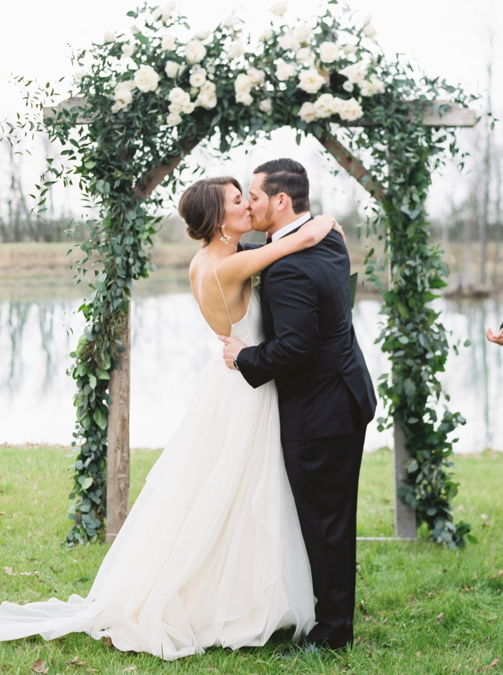 overcast wedding day, leanne marshall wedding gown, neutral wedding flowers, natural flowers, floral arch