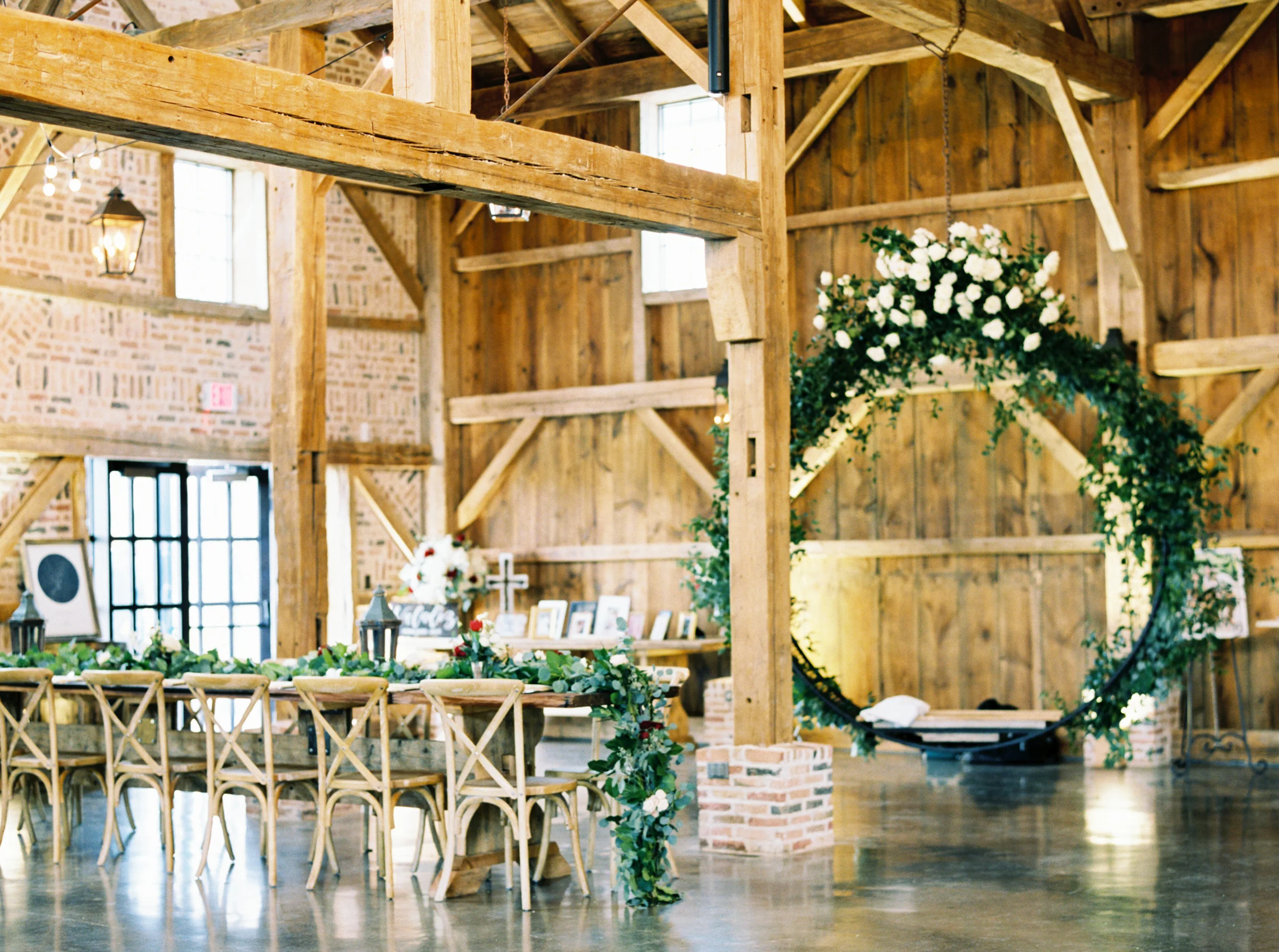 overcast wedding day, leanne marshall wedding gown, neutral wedding flowers, natural flowers, floral arch