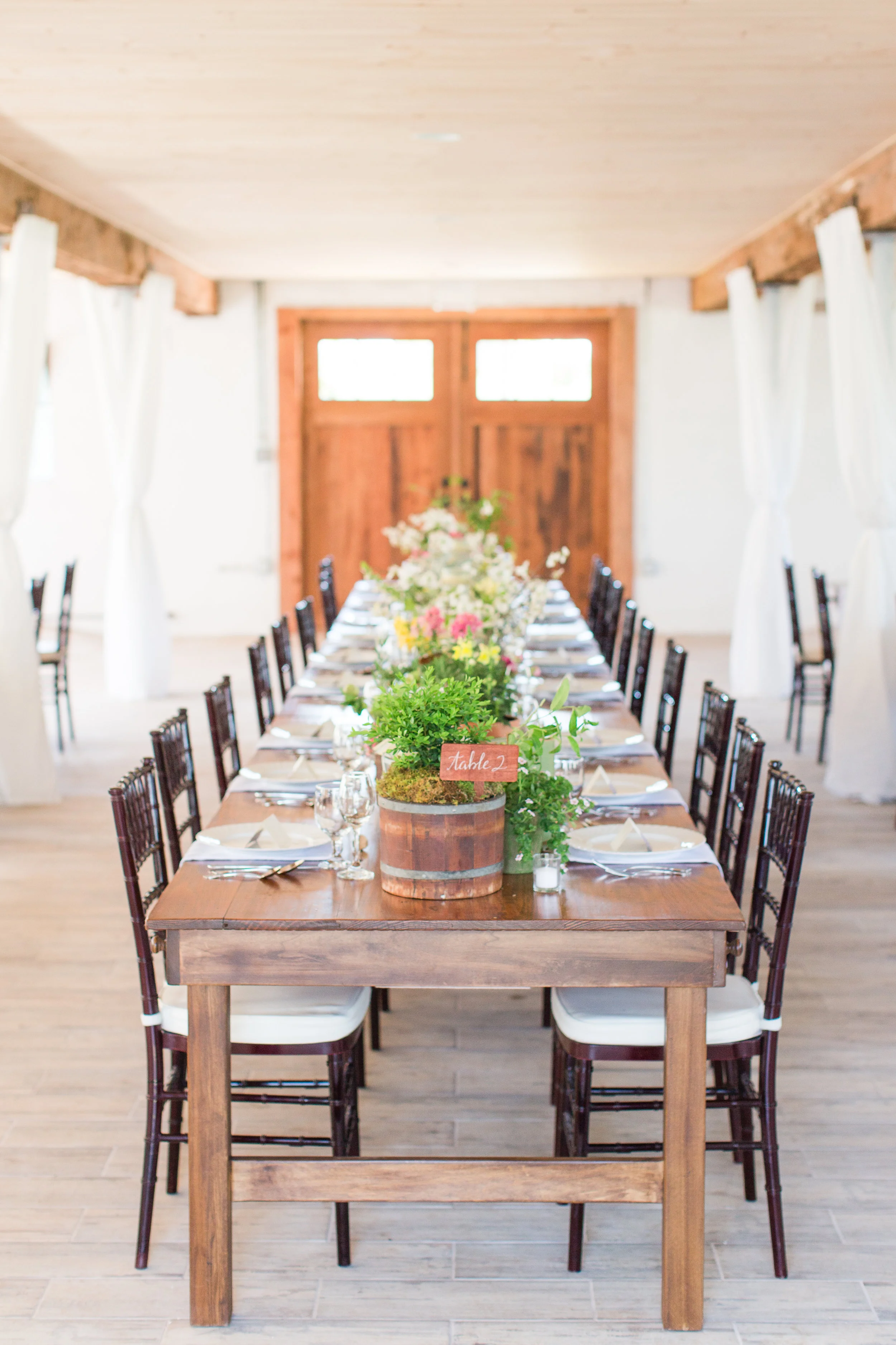 I love designing long tables! The inspiration for this table came from an English potting shed and featured a collection of potted plants, cut flowers, boxwood and vintage books on gardening from my library.