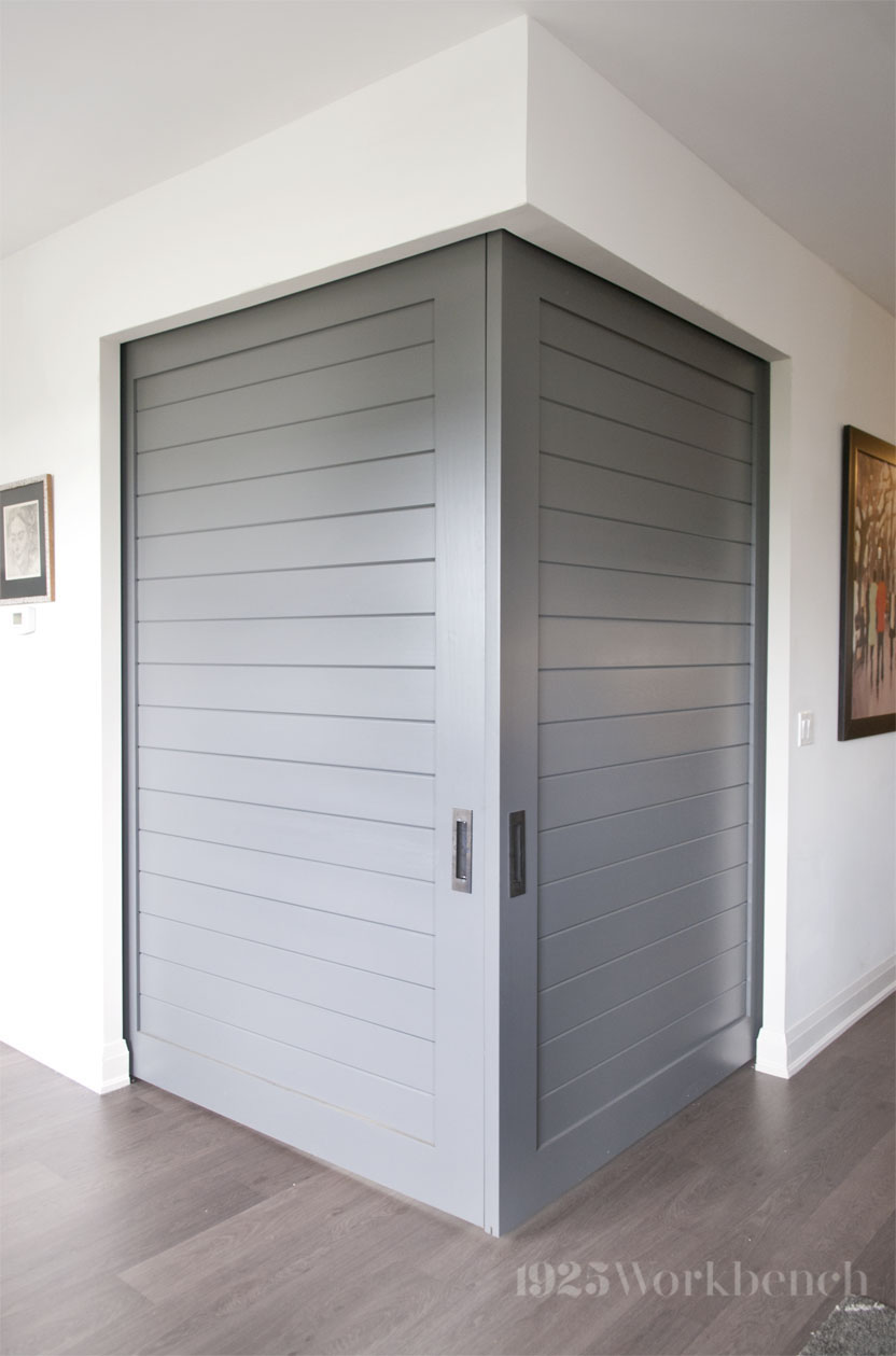 Panel door with horizontal tongue an grove for corner opening in a condo. The hardware was mounted on the inside of the room. 