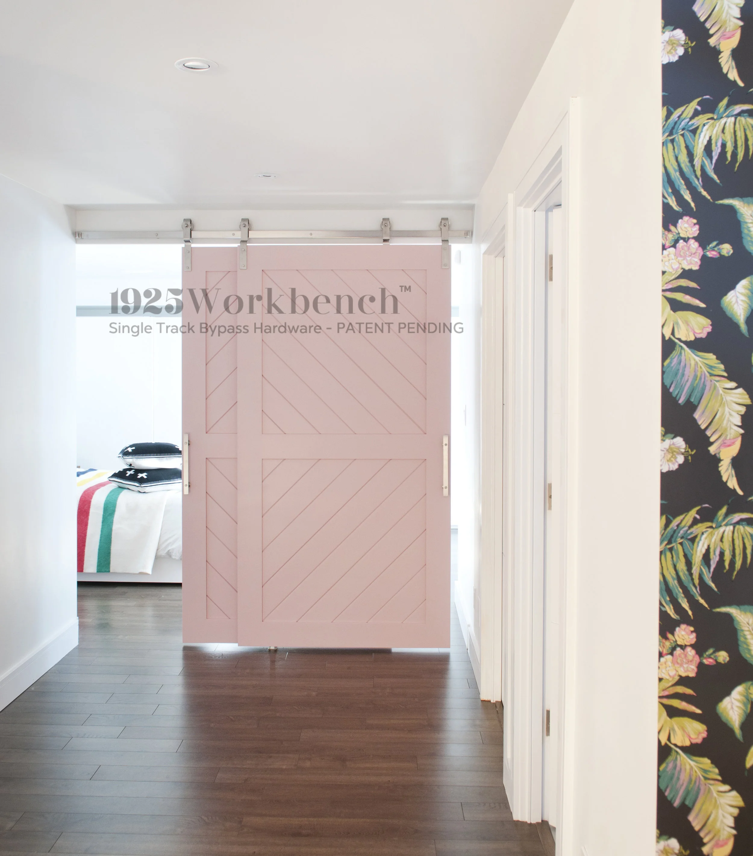 our stainless steel single track bypass on panel, chevron, pink doors we made to turn the back part of this basement a bedroom! 